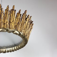 "Sun" ceiling lamp, carved in gilded and silver-plated wood with an acid-etched