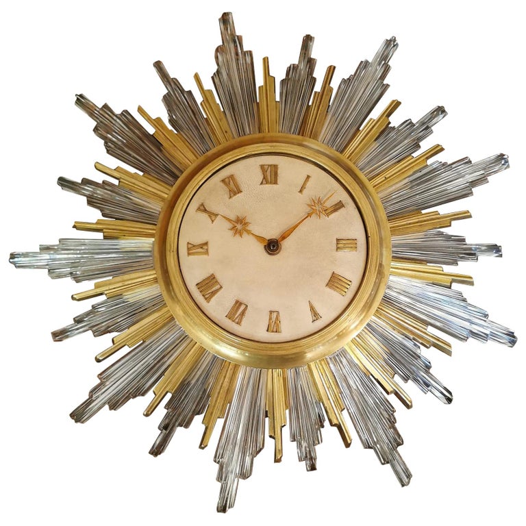Pendule de soleil en parchemin de cristal doré en bronze, vers 1940 par  bagues En vente sur 1stDibs