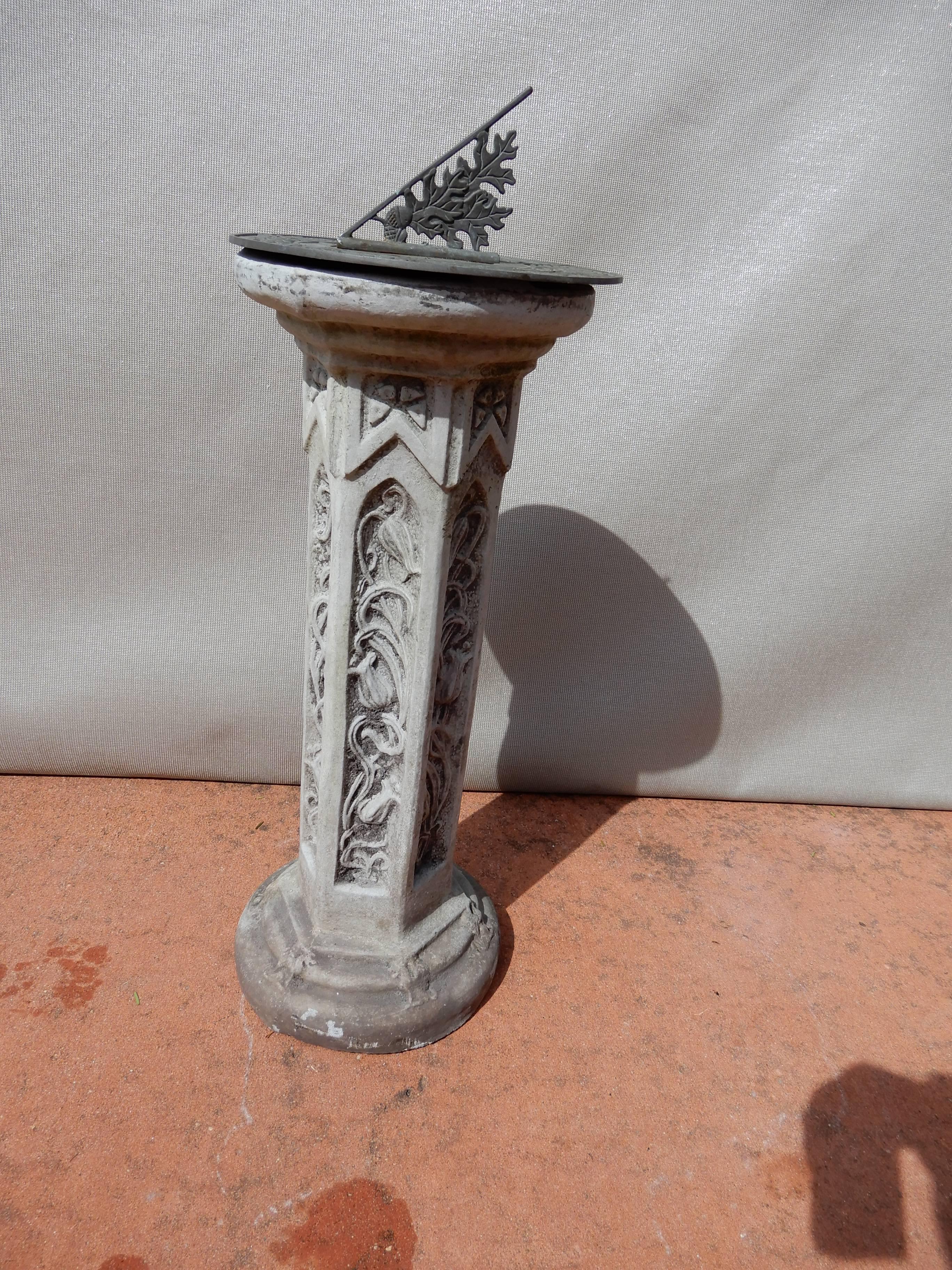 A cast stone sun dial. This sundial has the most ornate detailed ornate cast stone column.
The metal sundial with a nice patina.