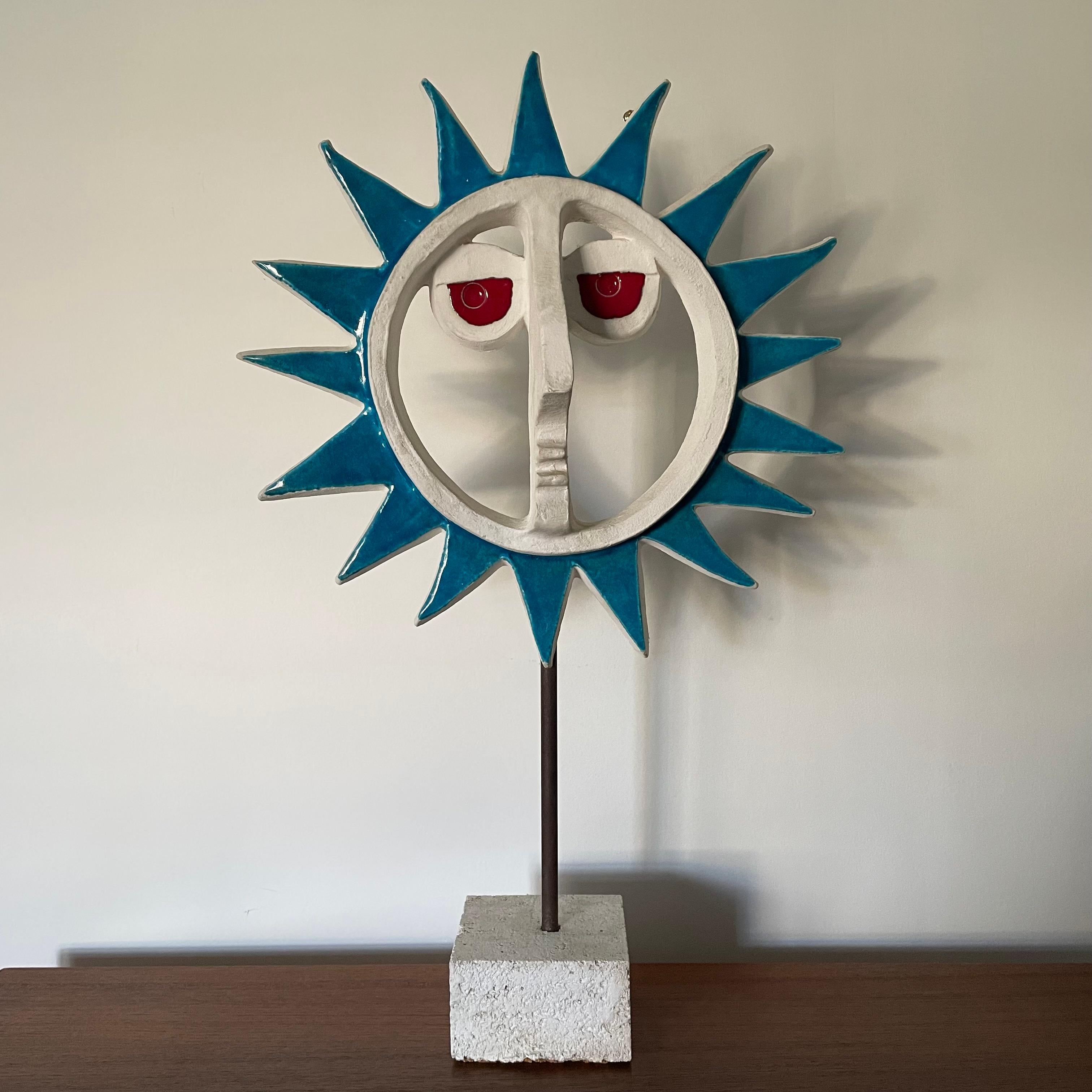 Impressive pottery sun face sculpture by David Gil, Bennington Potters, Vermont USA.
Face is mounted on a metal rod on square base. Marked on reverse.