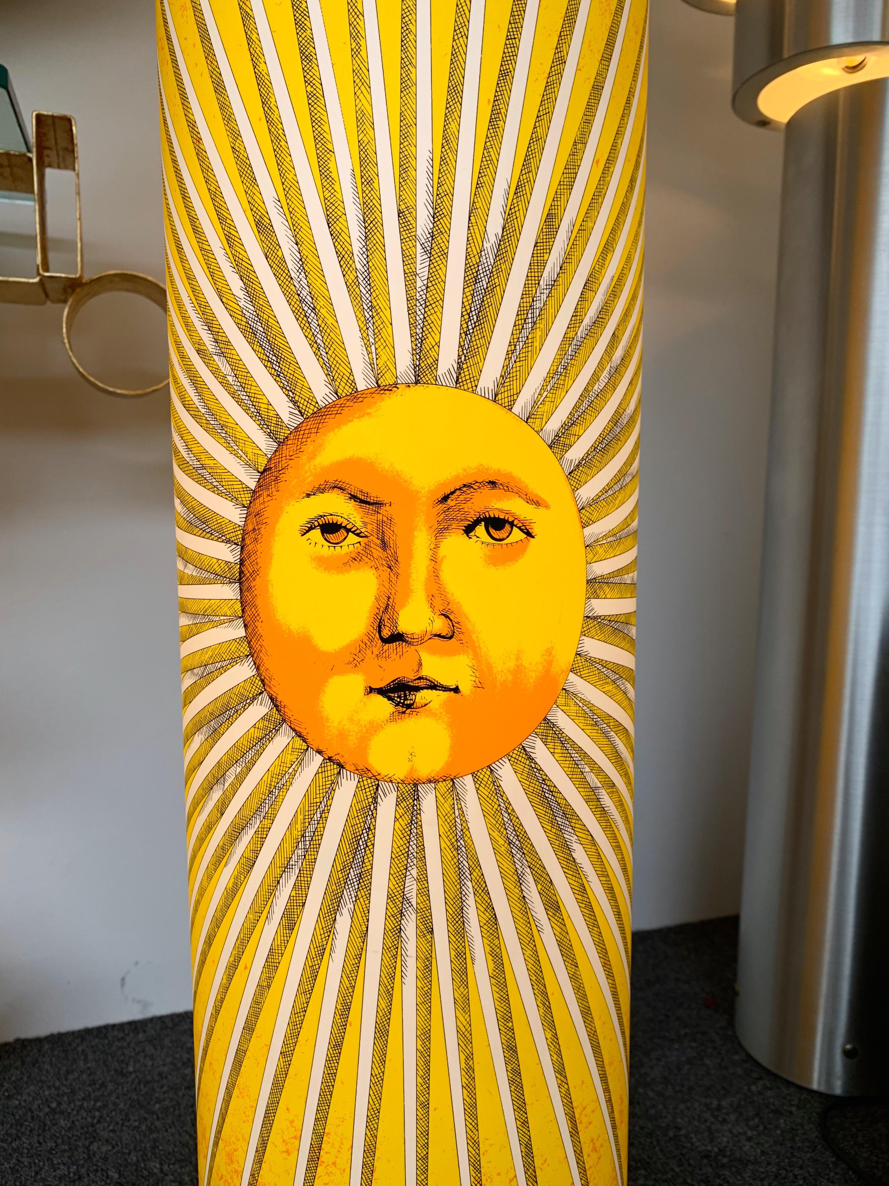 Floor lamp sun face in soft stamped plastic by Fornasetti for the editor Antonangeli Illuminazione.