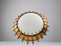 Sun lamp of forged nails with gold leaf and milk glass