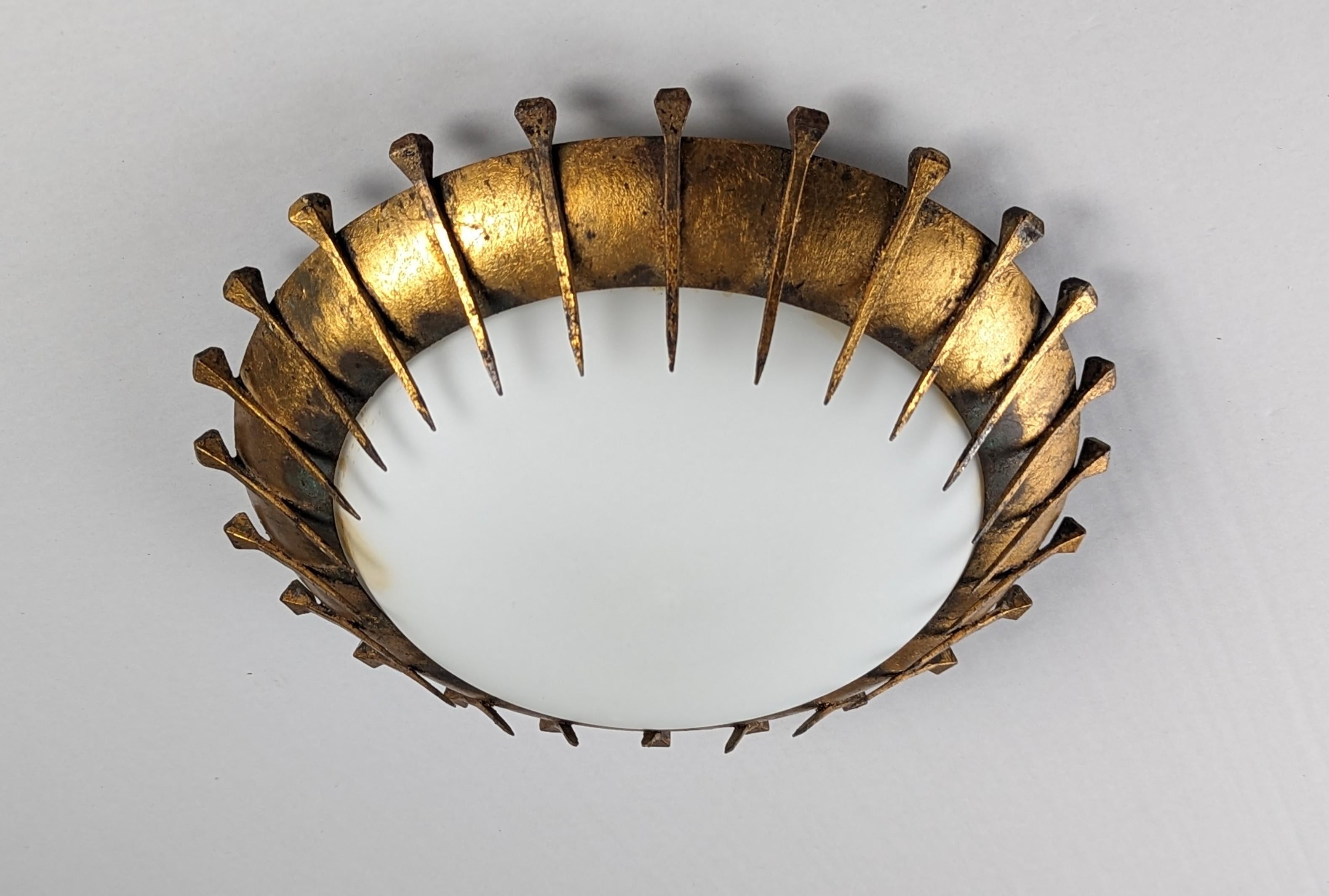 20th Century Sun lamp of forged nails with gold leaf and milk glass For Sale