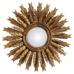 Sun Mirror with convex moon in a carved and gilded wooden frame