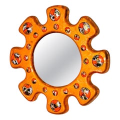 Sun shaped Modernist enamel mirror by J. Capo Esmaltes, Spain, 1970's