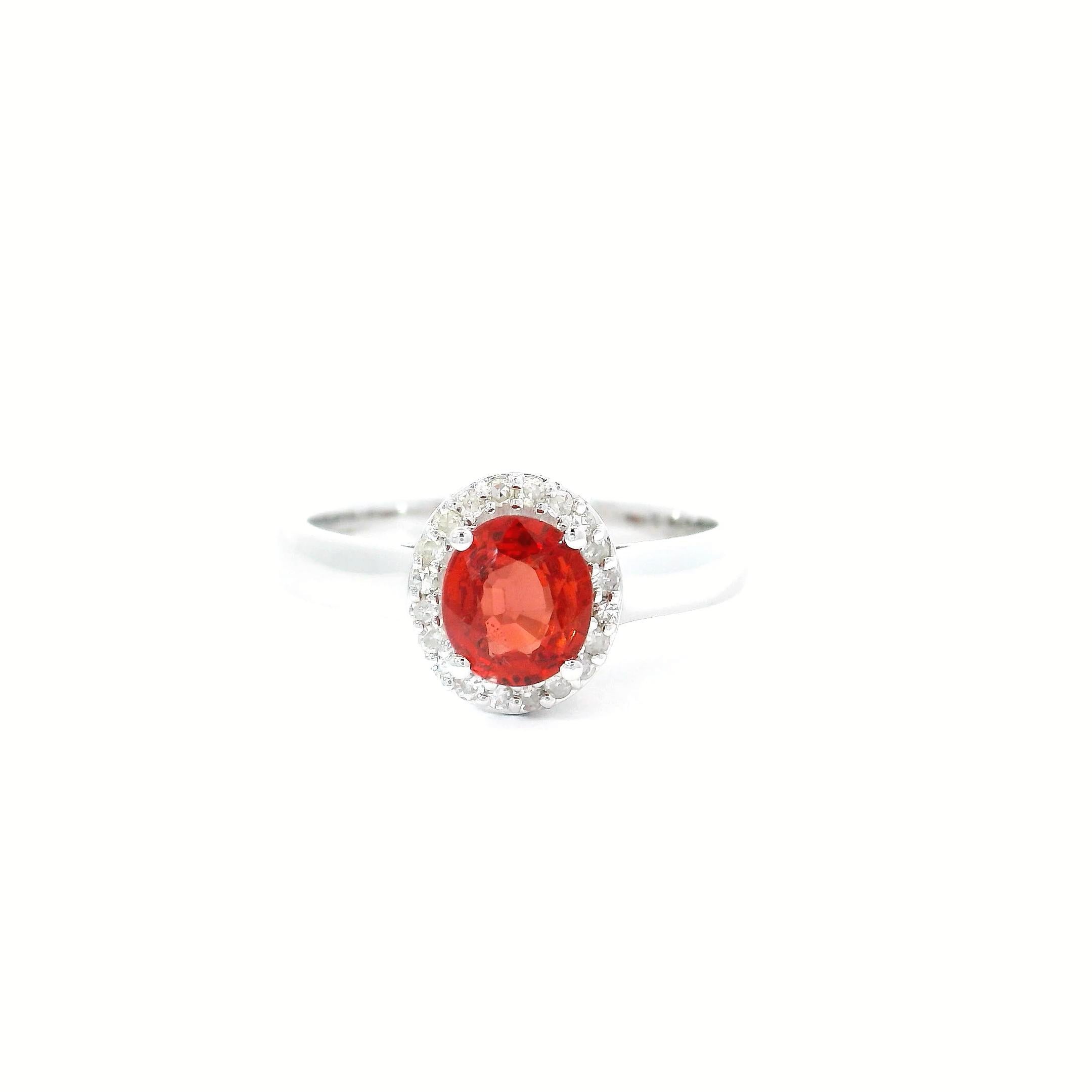 18kt white gold sun stone Ring
  
  Gold colour & karat: White gold 18kt
  Weight: 3.97 grams
  
  Set with-
  Stone type: Diamond
  Shape: oval
  Carat: 0.94 cts
  Colour: Red Colour
  
  Surrounding Stones: Diamonds
 1) White Diamonds
  Carat