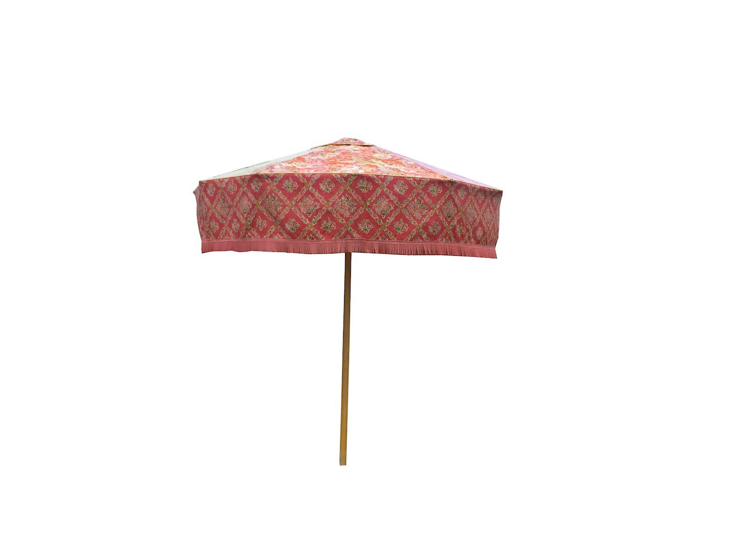 You are viewing one of Sunbeam Jackie's iconic sun umbrellas. 

This patio umbrella is made using a unique combination of vintage fabrics from legendary British textile houses including Designers Guild and Sanderson.

Sunbeam Jackie's iconic