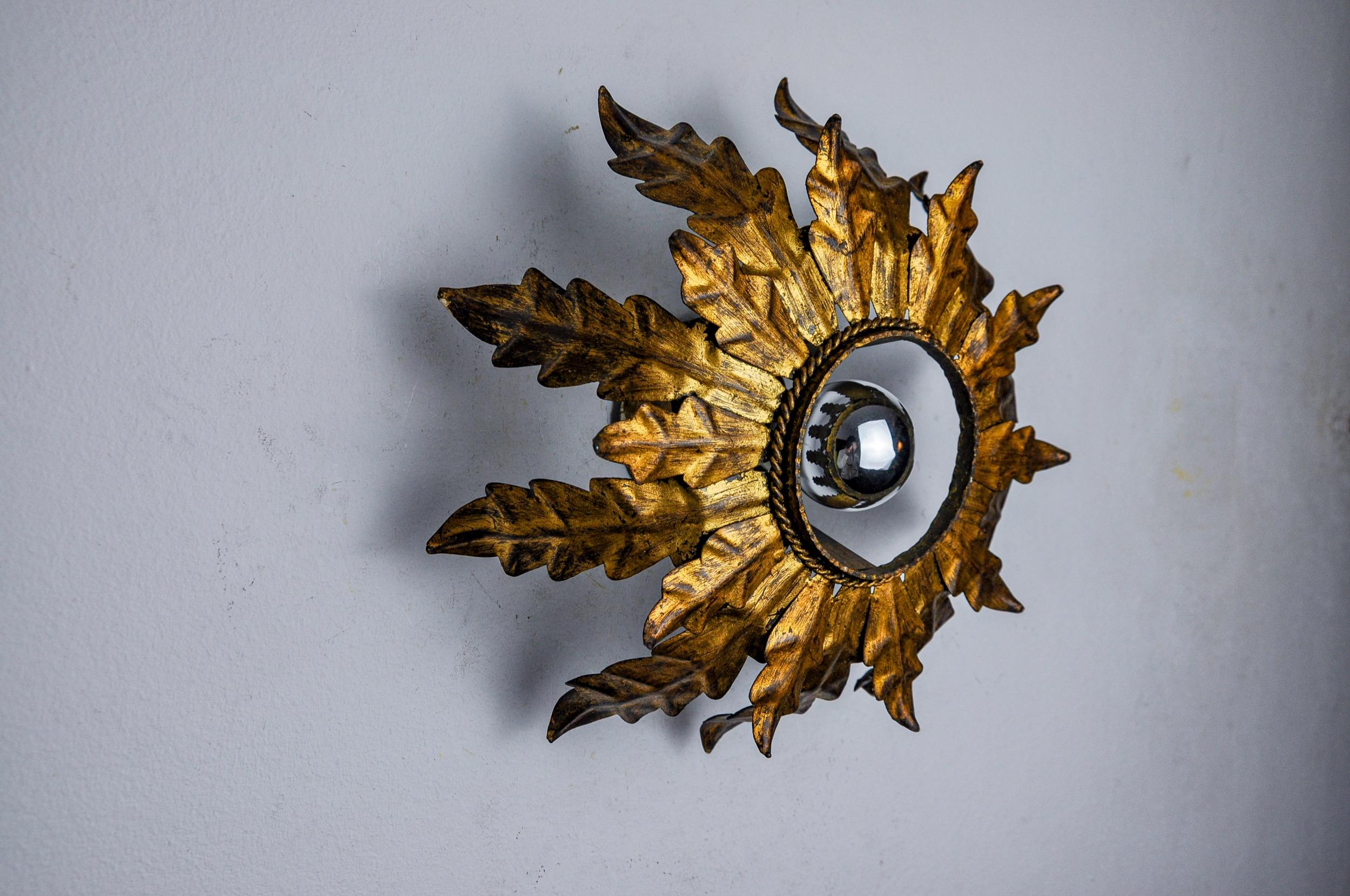 Spanish Sun wall lamp by ferro arte, metal and gold leaf, Spain, 1960 For Sale