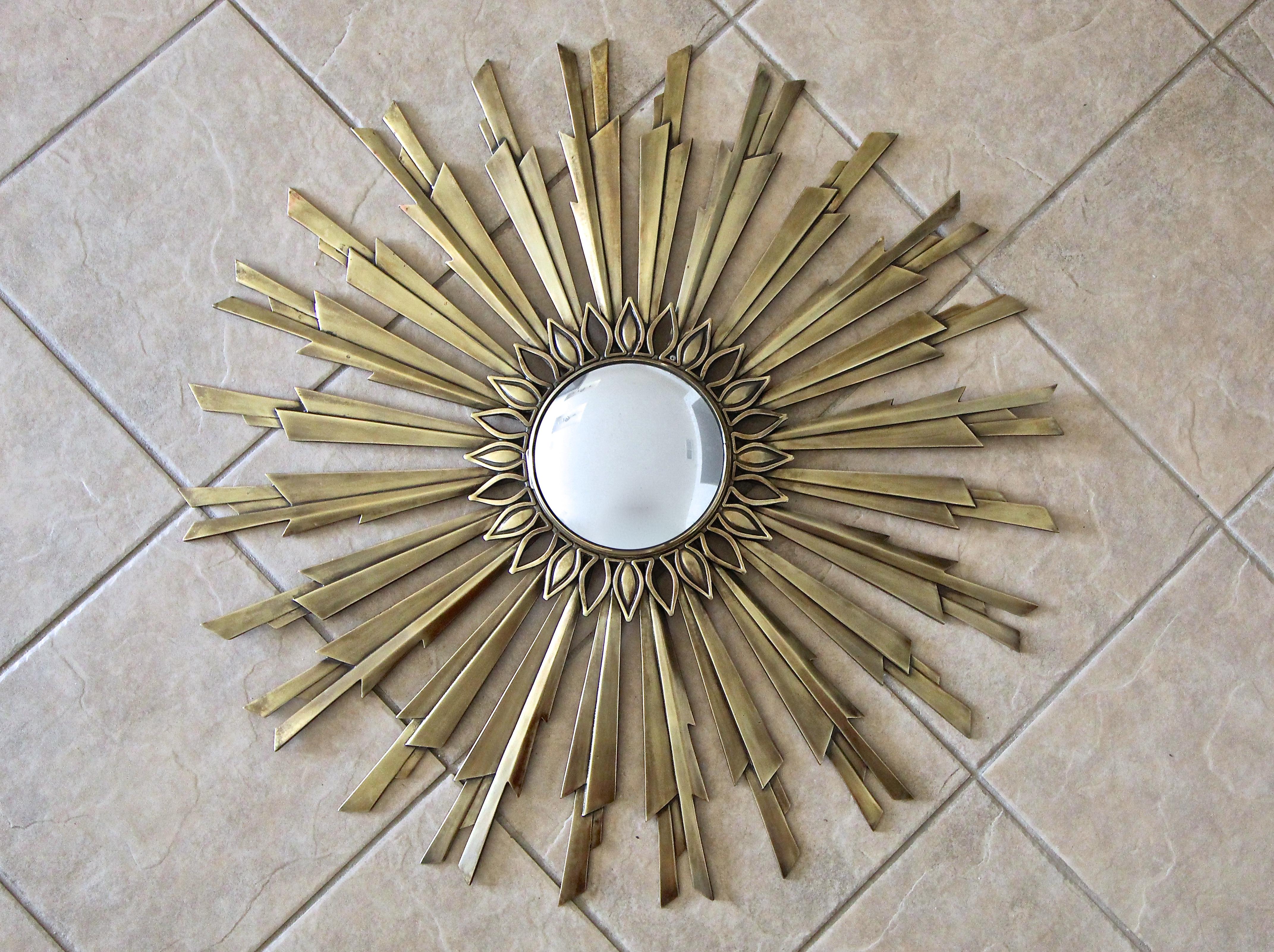 Art Deco sunburst or starburst bronze or brass wall mirror with thick angled 
