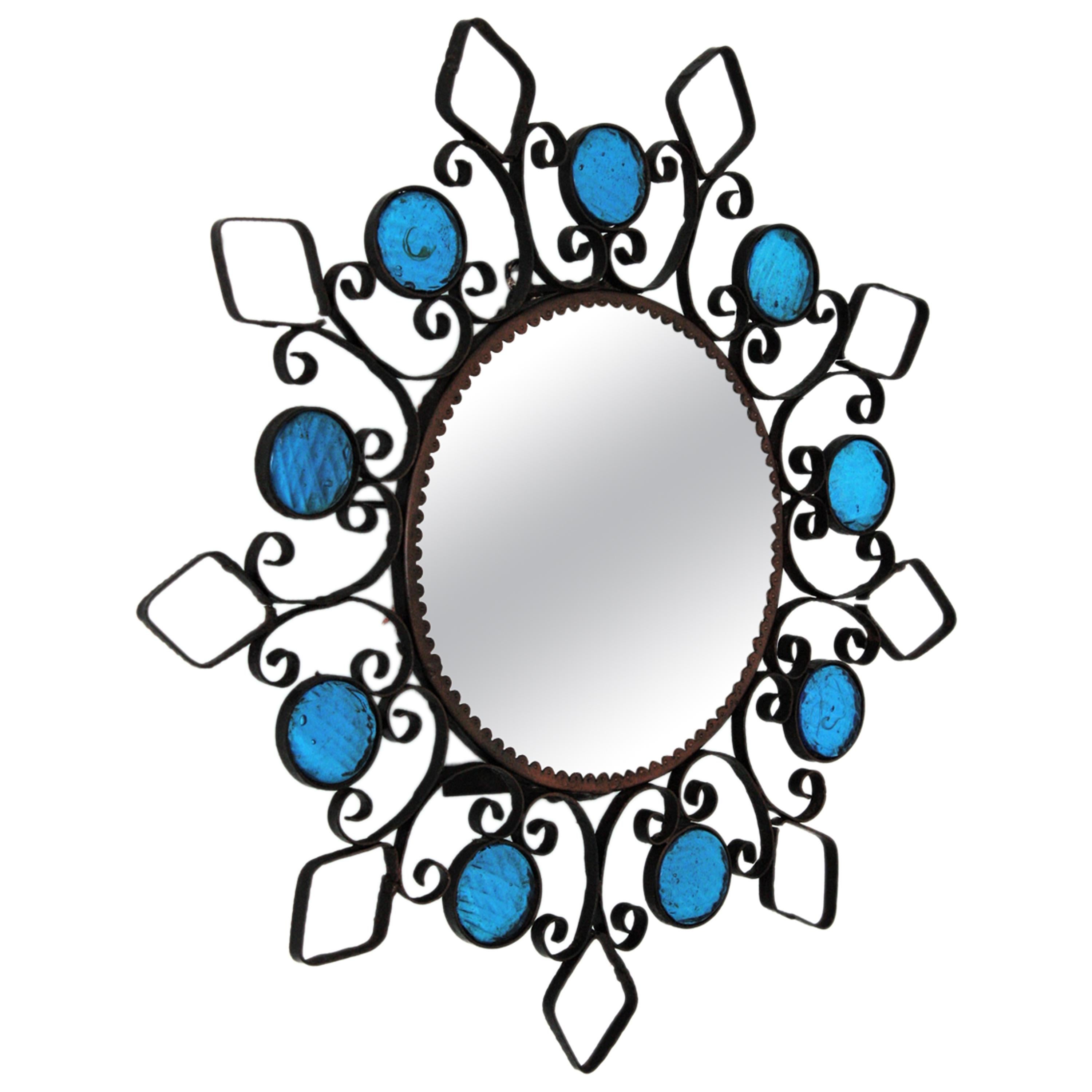 Sunburst-Spiegel/Wandleuchte aus Schmiedeeisen und blauem Glas mit Rückenleuchter