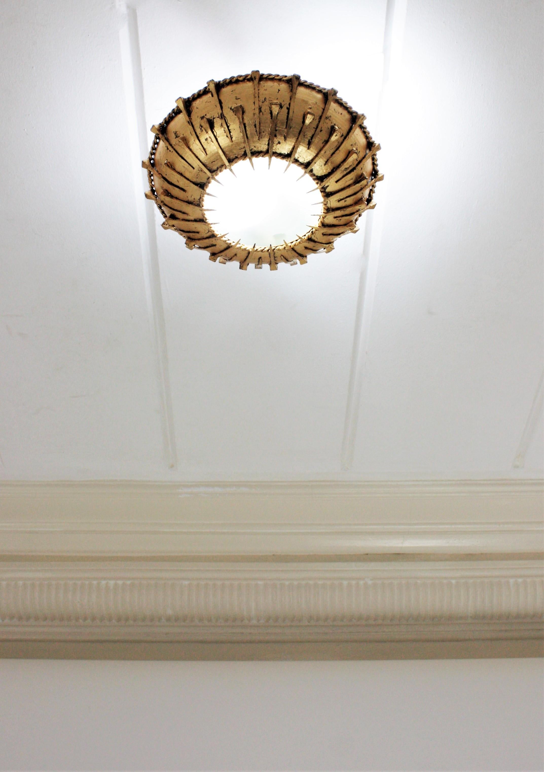 Mid-Century Modern Sunburst Brutalist Ceiling Light Fixture with Nail Motifs, Gilt Iron and Glass For Sale