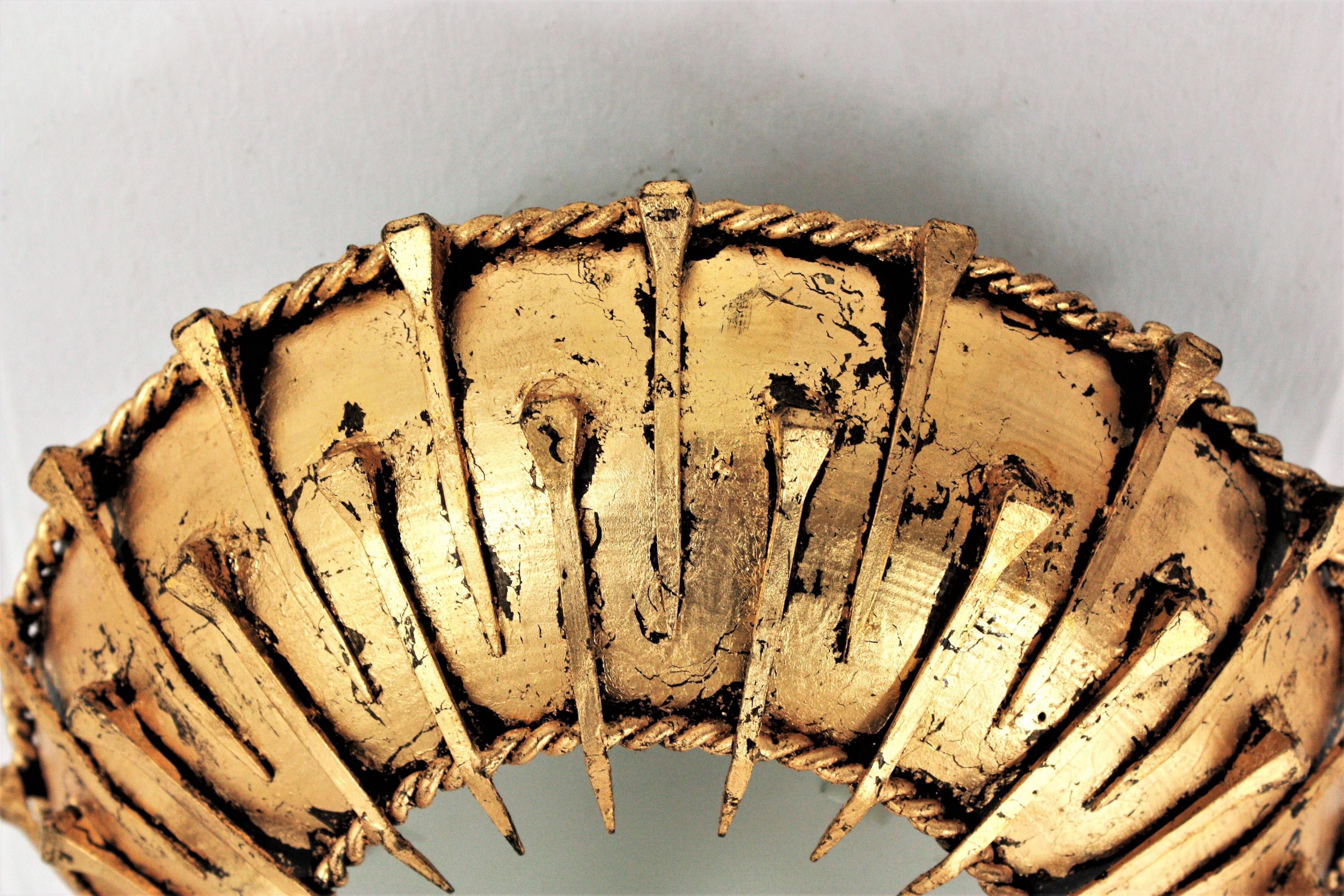 Sunburst Brutalist Ceiling Light Fixture with Nail Motifs, Gilt Iron and Glass In Good Condition For Sale In Barcelona, ES