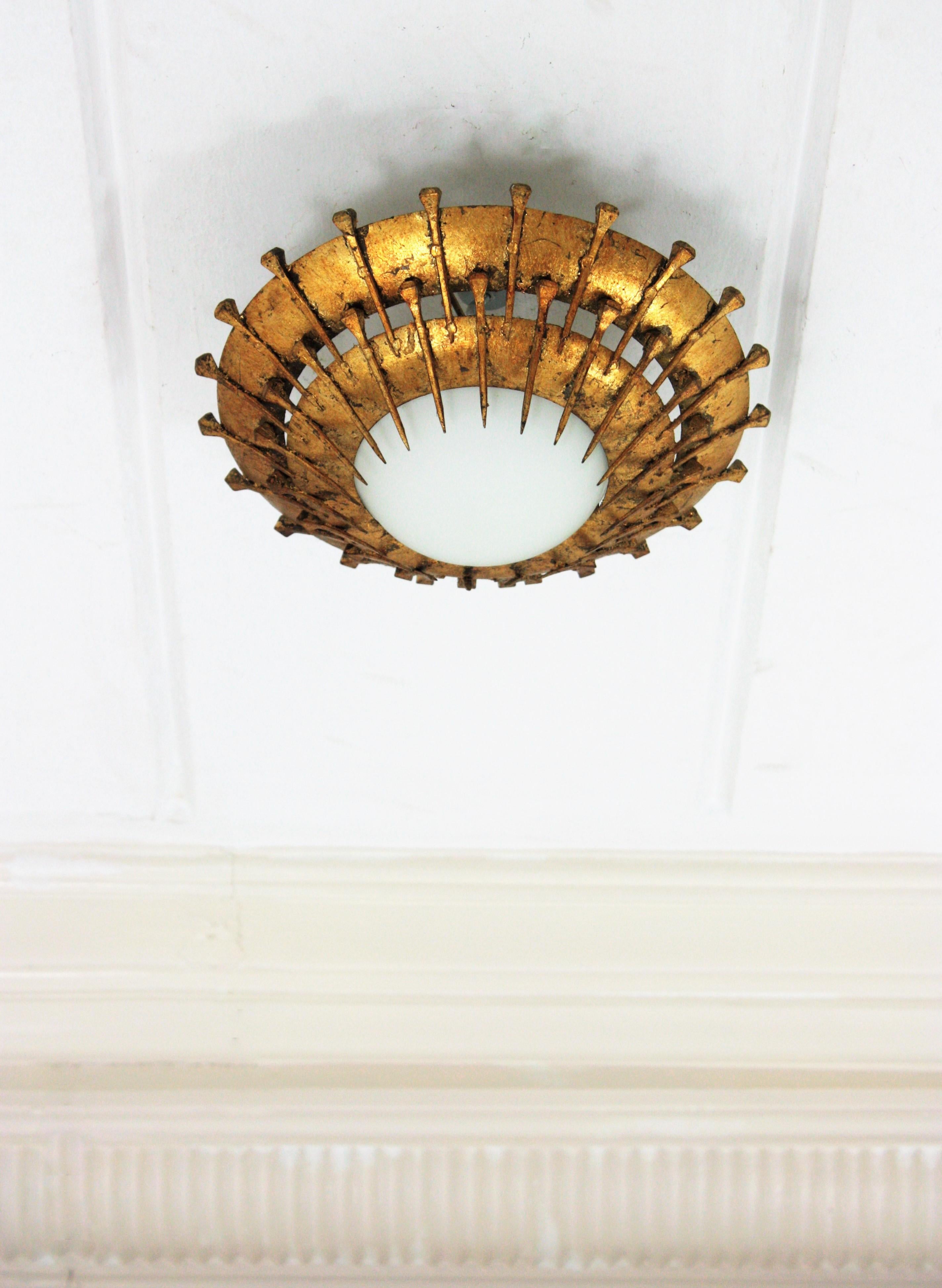 French Sunburst Light Fixture with Nail Design, Gilt Iron, Milk Glass In Good Condition For Sale In Barcelona, ES