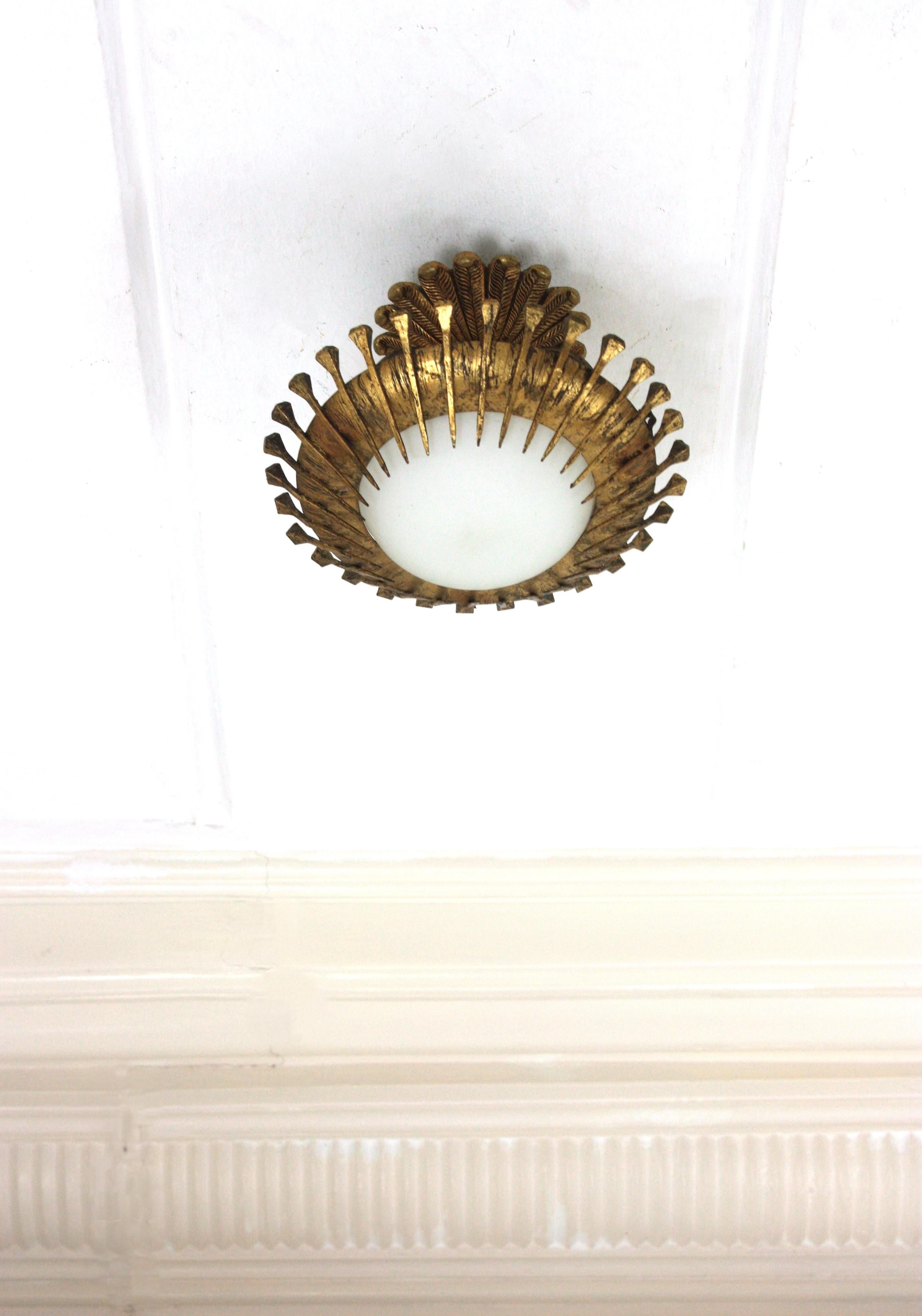 Brutalist French Sunburst Light Fixture with Nails Detail, Gilt Iron and Milk Glass For Sale
