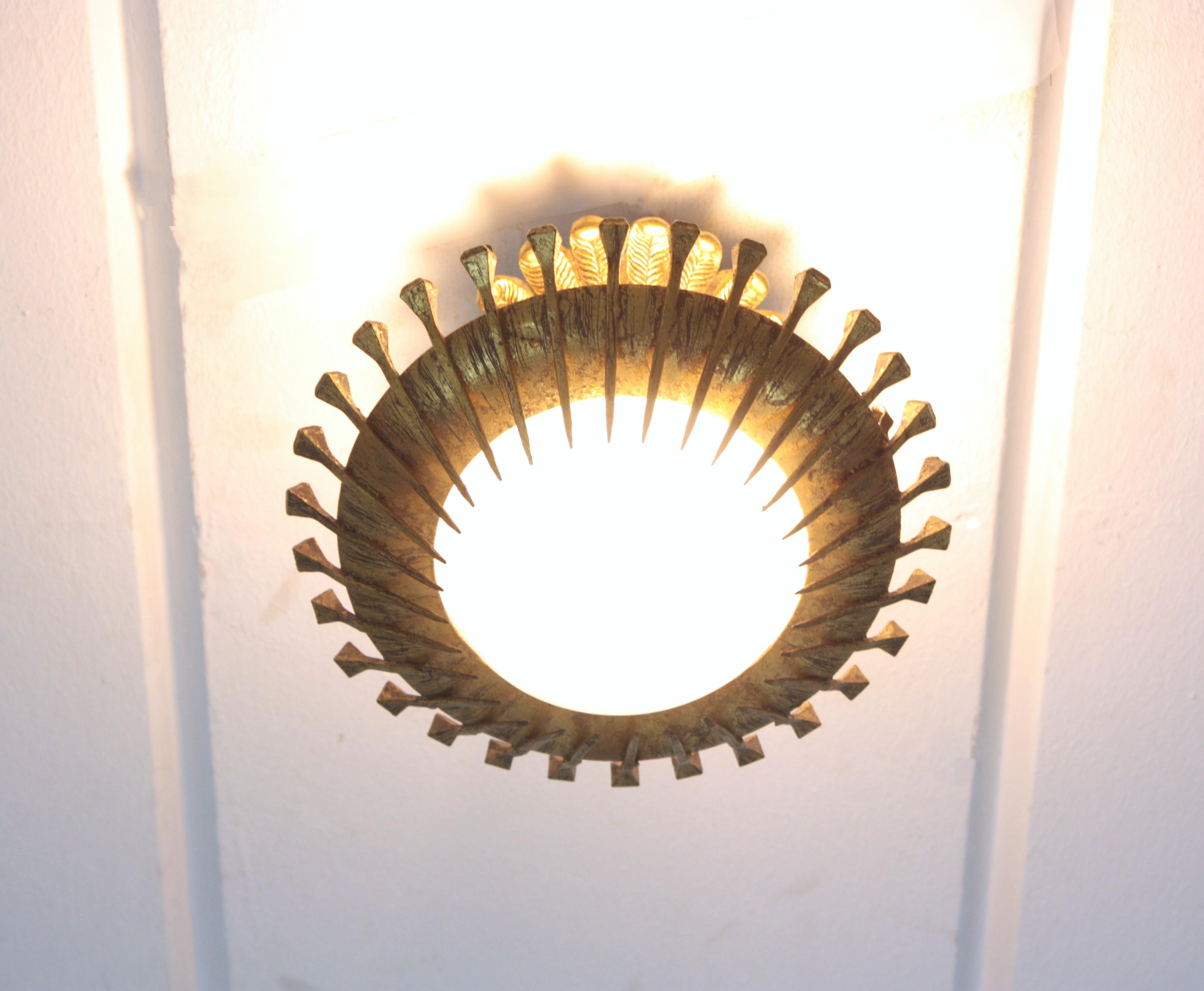 Spanish French Sunburst Light Fixture with Nails Detail, Gilt Iron and Milk Glass For Sale