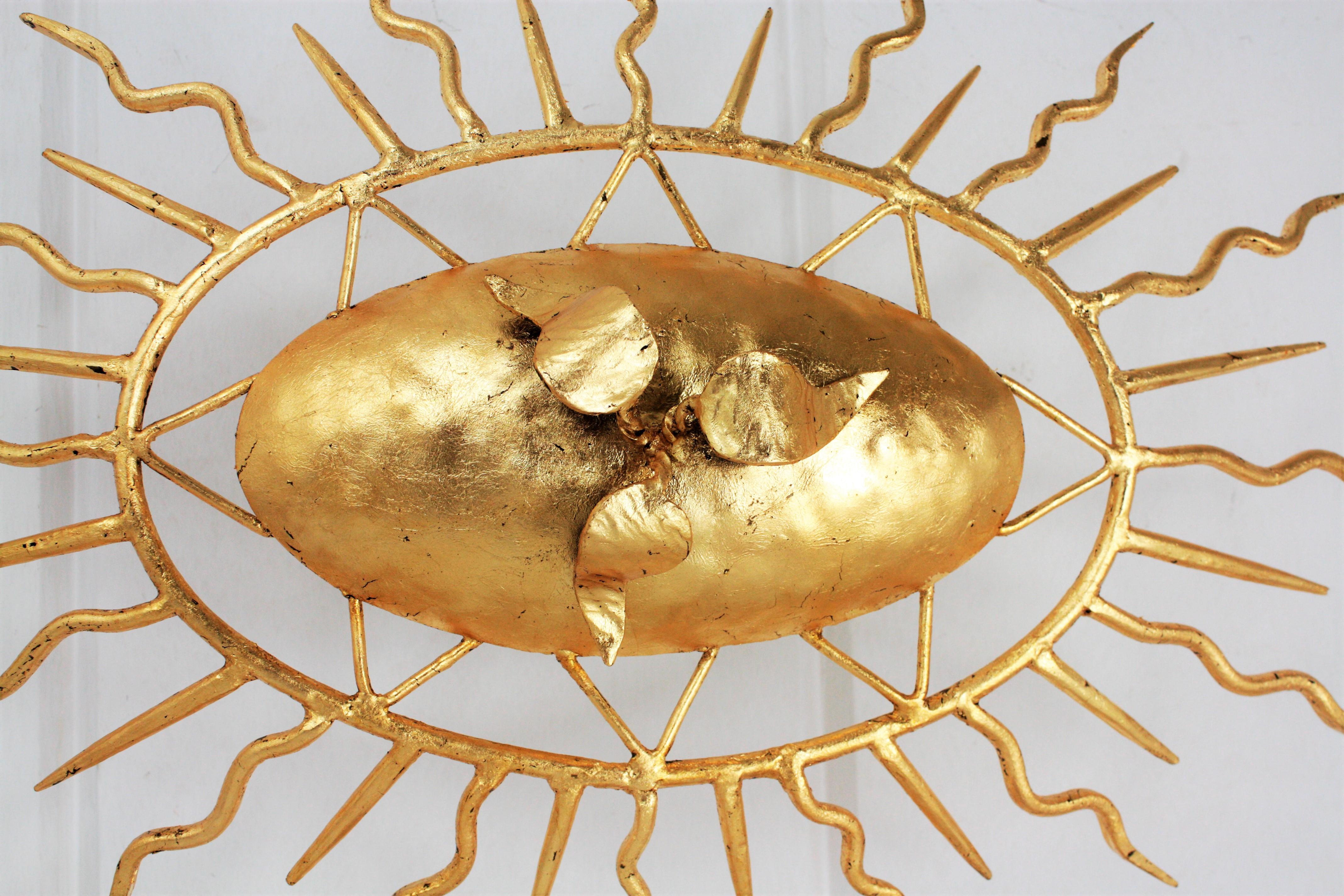 Spanish Sunburst Brutalist Oval Light Fixture in Gilt Iron, 1950s In Good Condition For Sale In Barcelona, ES