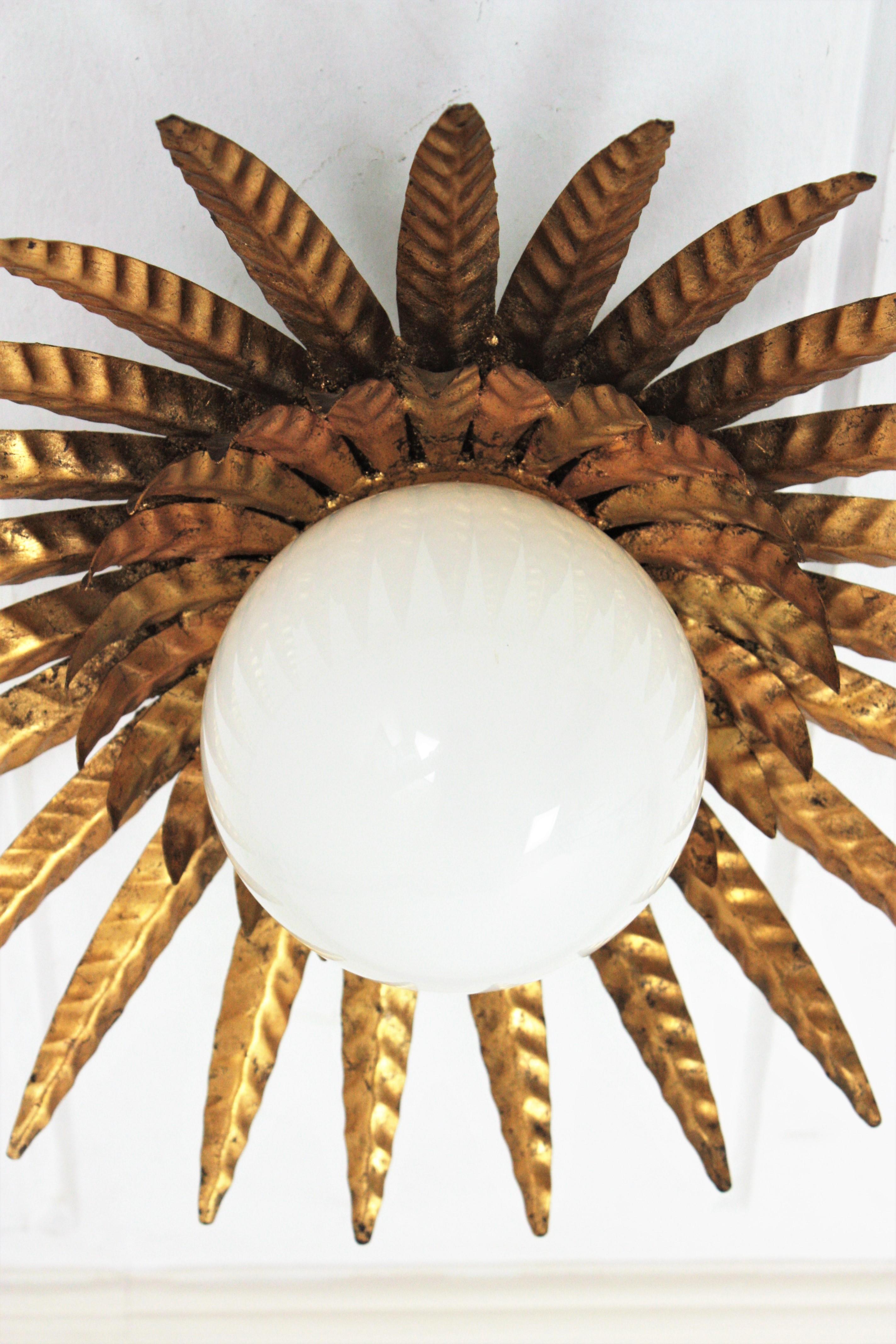 Hand-Crafted Sunburst Ceiling Light Fixture in Gilt Iron with Milk Glass Globe  For Sale
