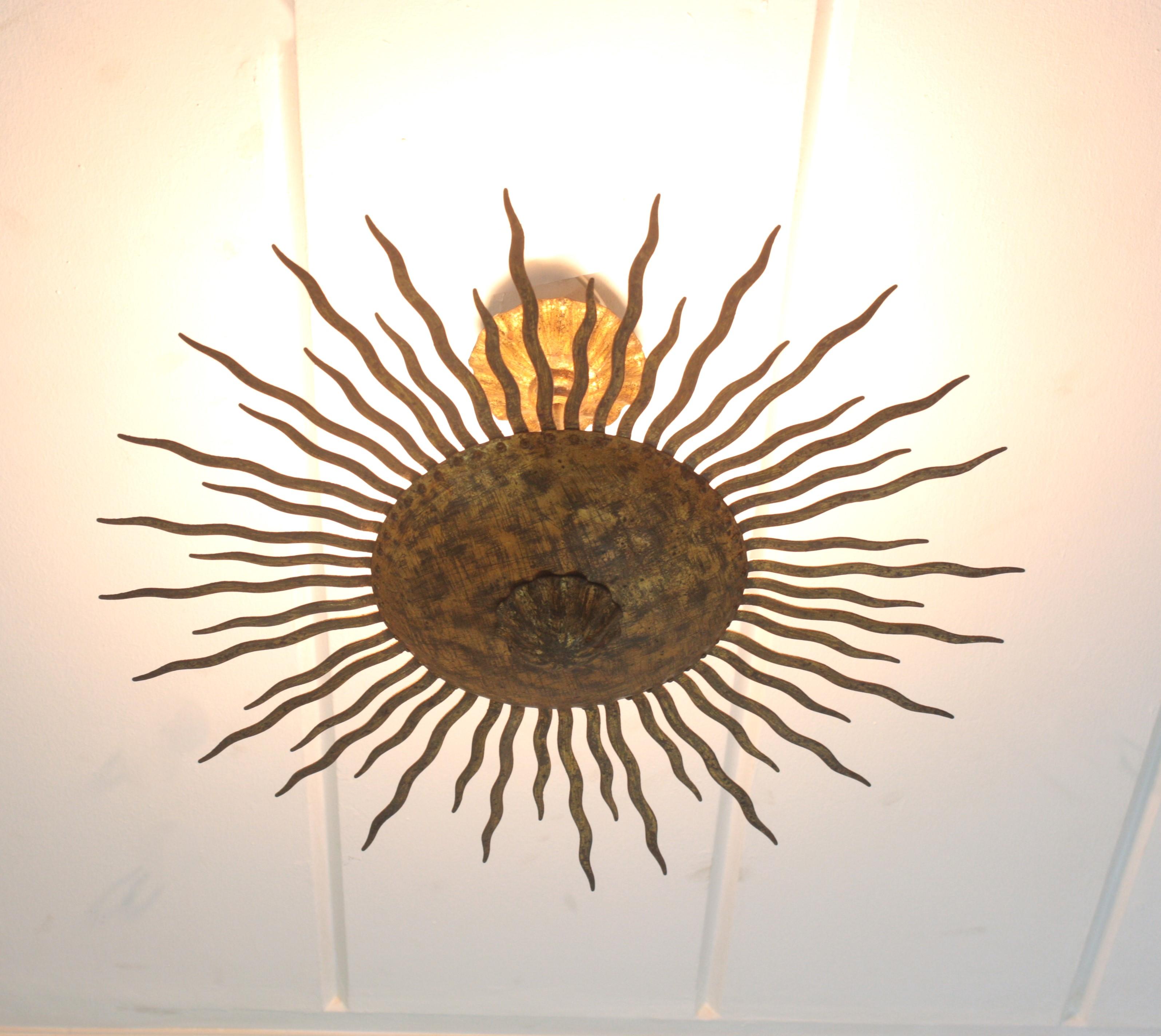 Mid-Century Modern Sunburst Ceiling Light Fixture or Chandelier with Curly Rays, Gilt Iron For Sale