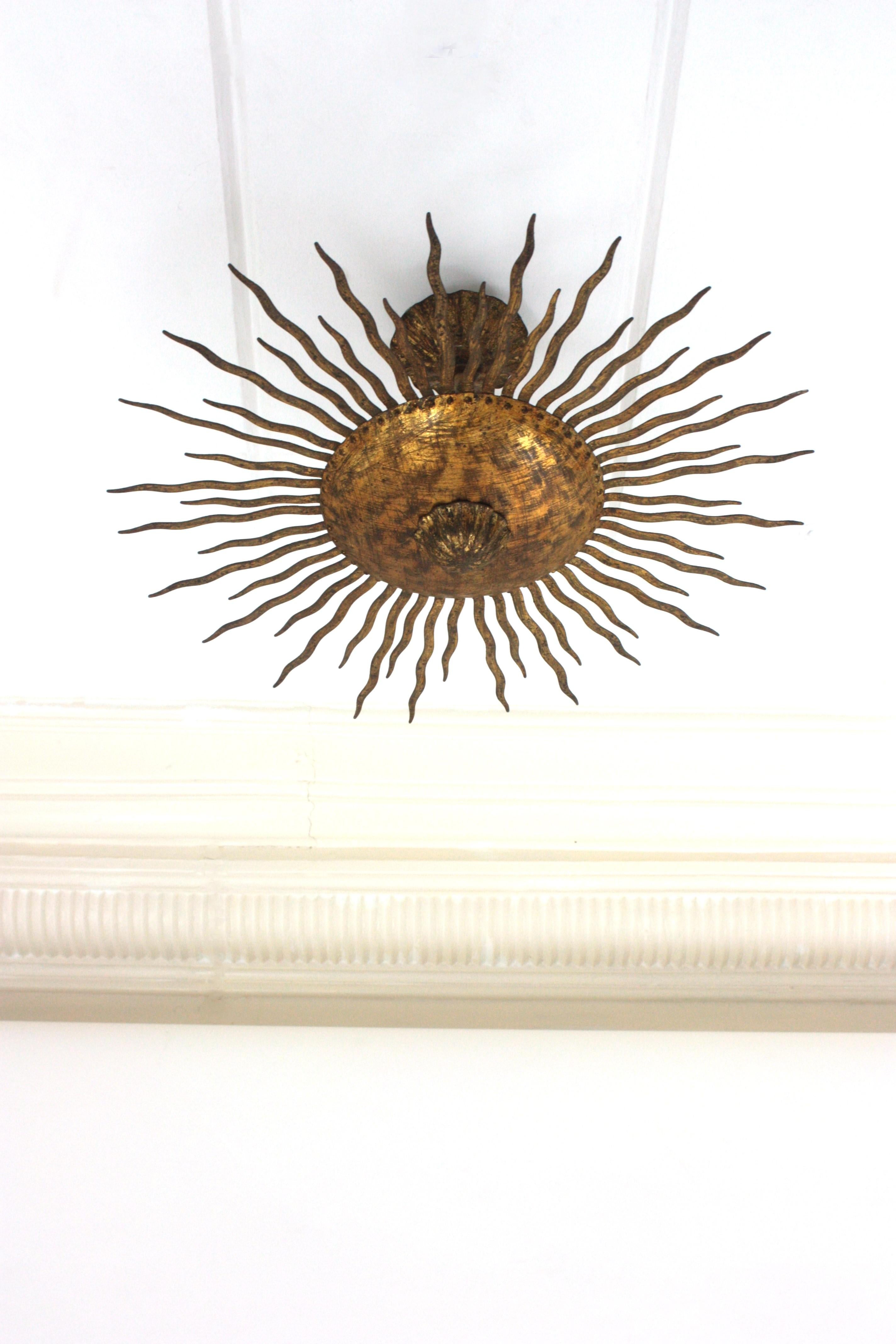 French Sunburst Ceiling Light Fixture or Chandelier with Curly Rays, Gilt Iron For Sale
