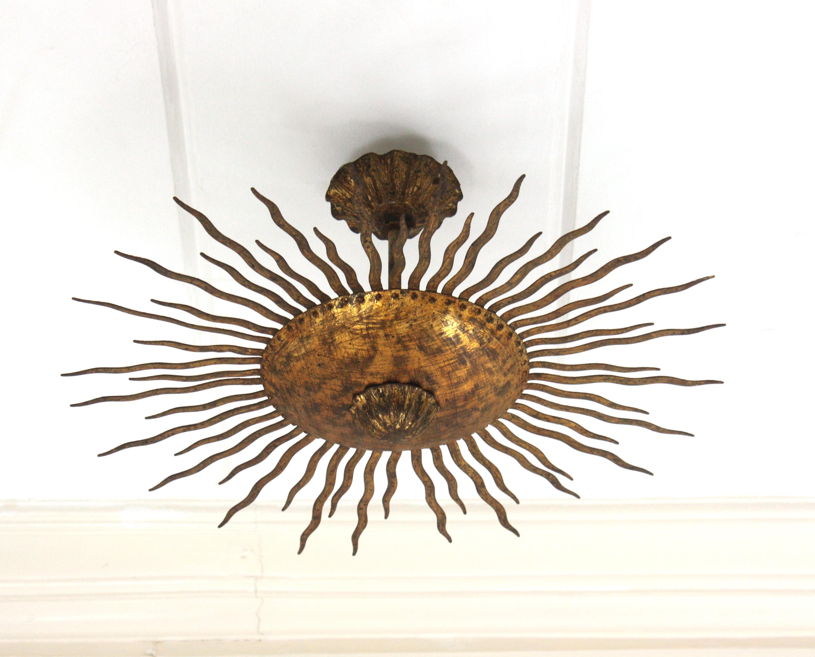 Sunburst Ceiling Light Fixture or Chandelier with Curly Rays, Gilt Iron In Good Condition For Sale In Barcelona, ES