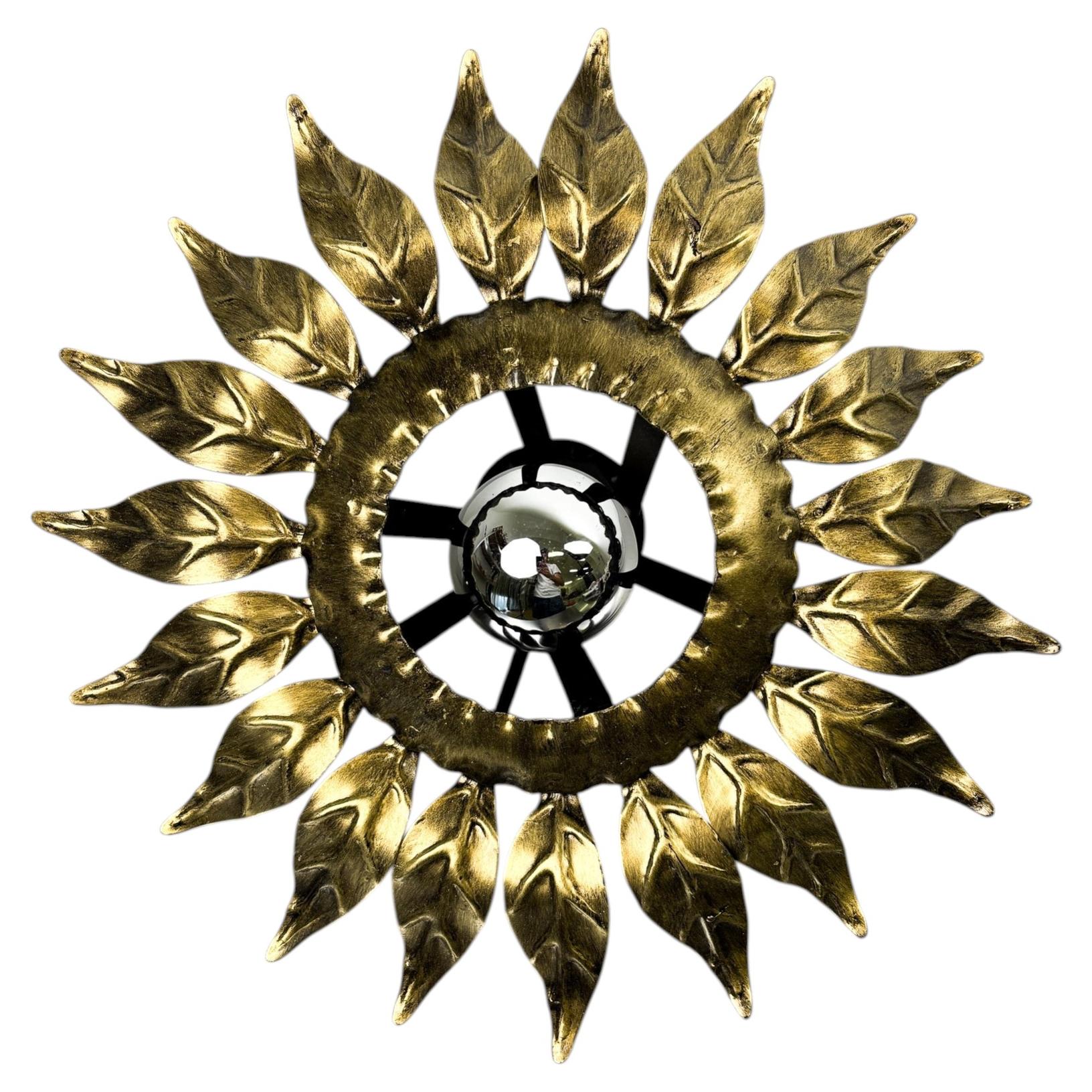 Sunburst ceiling light fixture or sconce in Gilt Wrought Iron, Spain, Circa 1960 For Sale