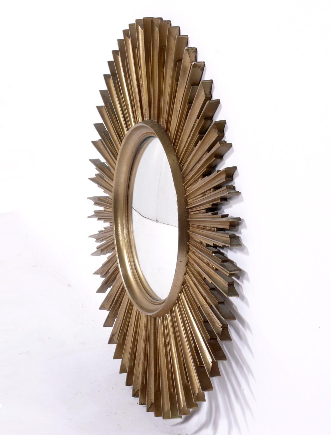 Starburst convex mirror, by Syroco, American, circa 1950s. Executed in 