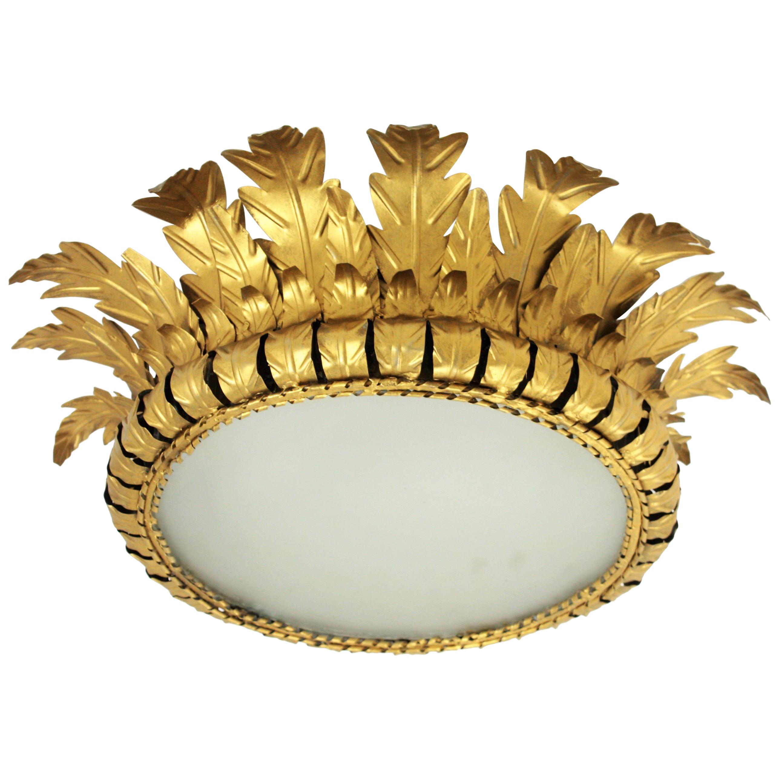 Large midcentury gilt metal crown sunburst flush mount with leaf motif, Spain, 1950s-1960s.
A beautiful 22