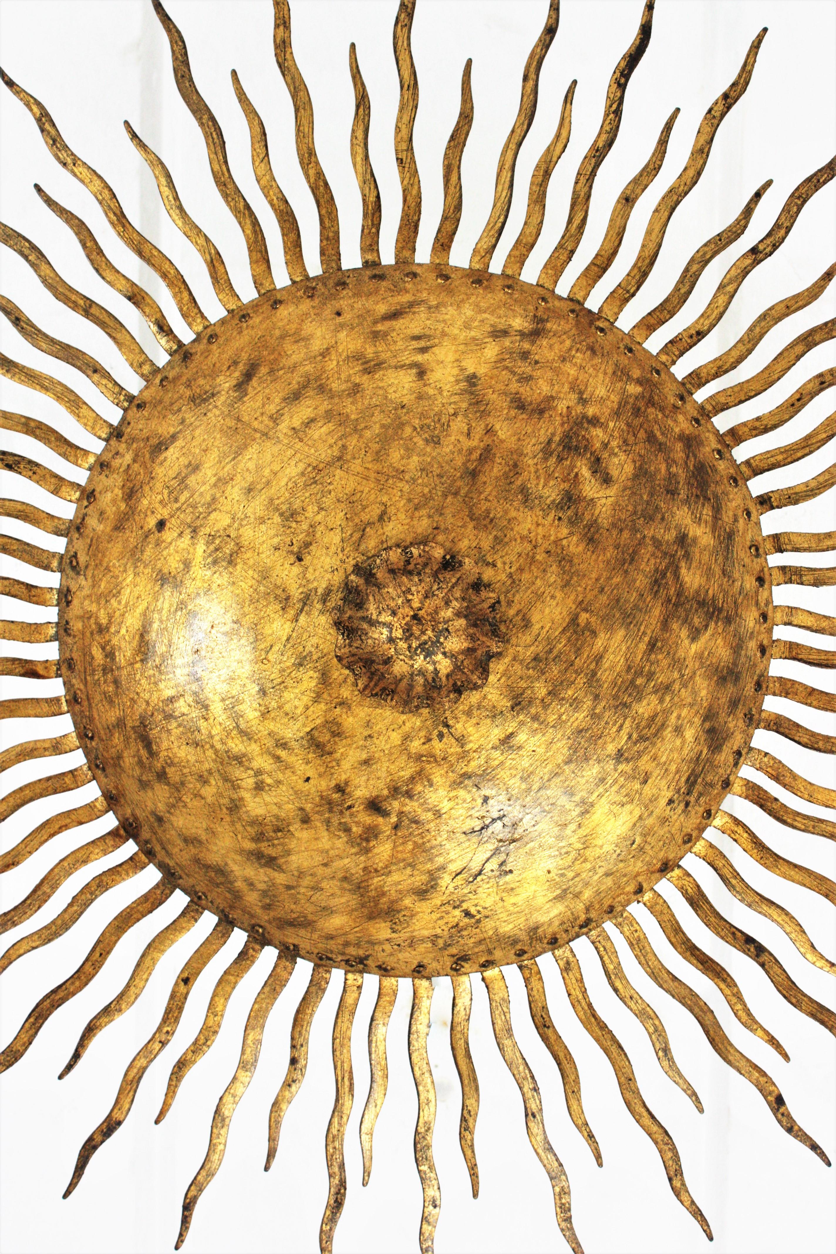 French Sunburst Curly Ceiling Light Fixture / Chandelier in Gilt Iron For Sale