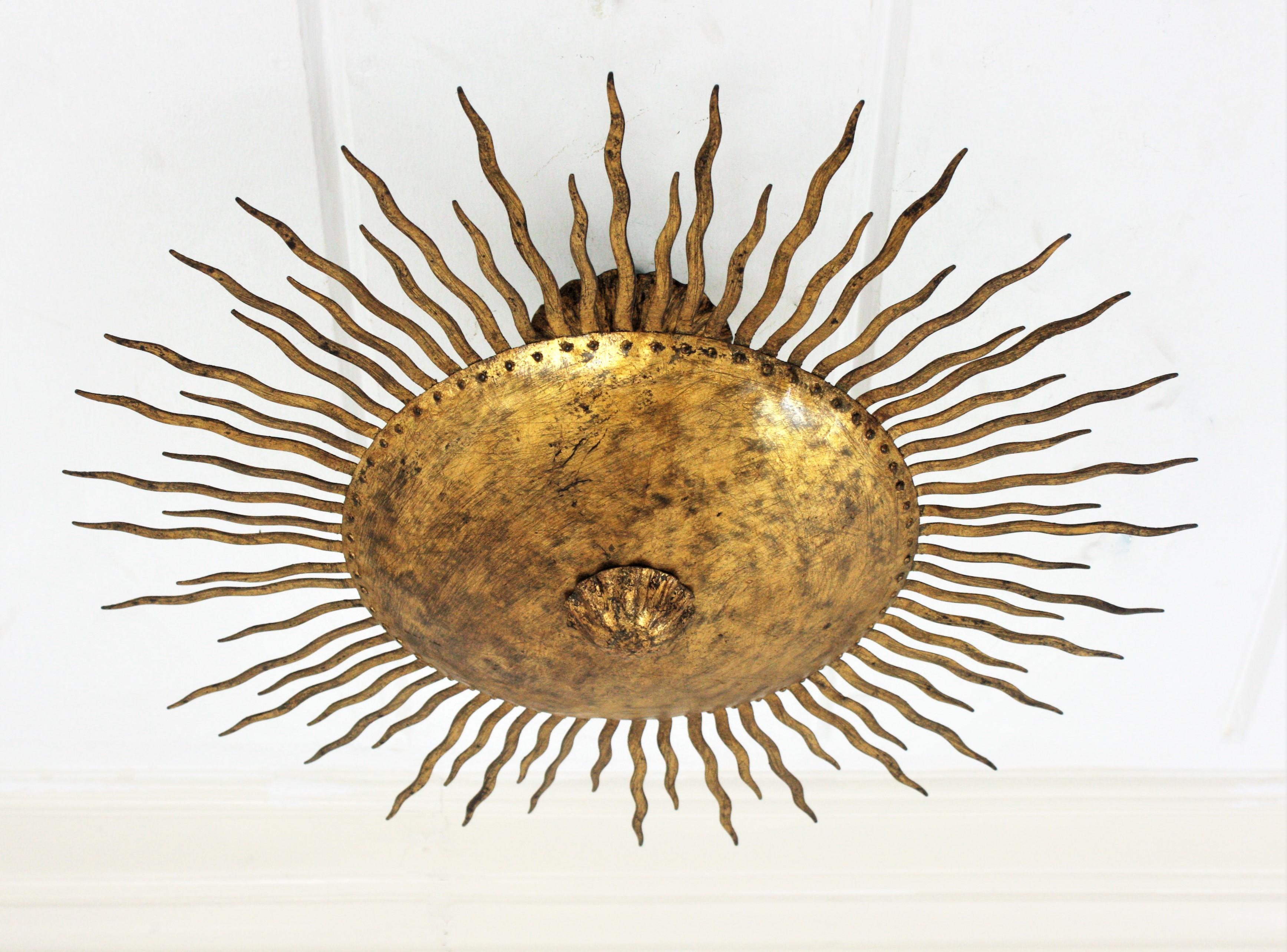 Forged Sunburst Curly Ceiling Light Fixture / Chandelier in Gilt Iron For Sale