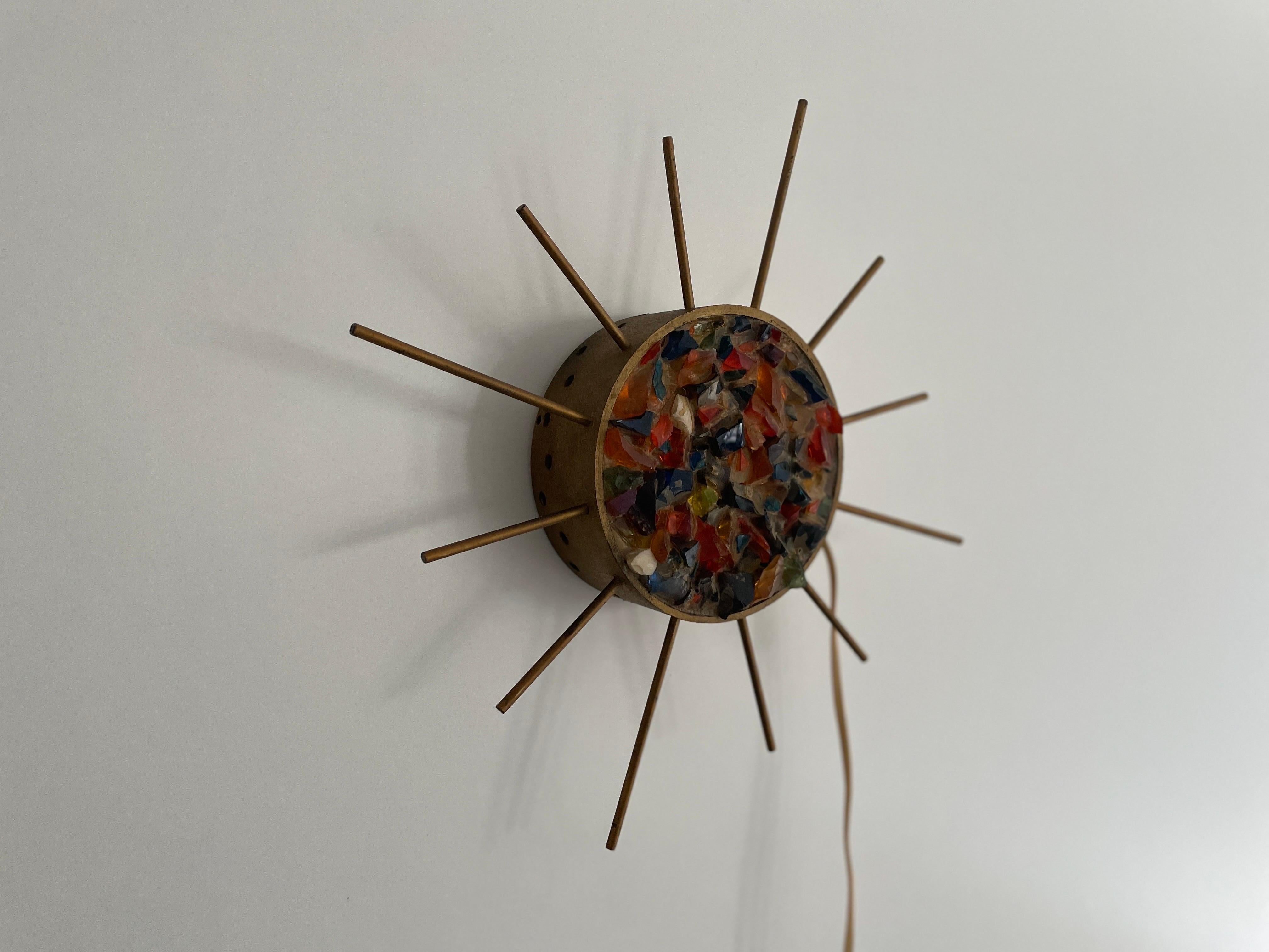 Sunburst Design Colorful Pieces Glass in Stone Form Wall Lamp, 1960s, Germany

Very elegant and Minimalist wall lamp, it can be use as a table lamp

Lamps is in very good condition.

These lamps works with E14 standard light bulbs. Each lamp works