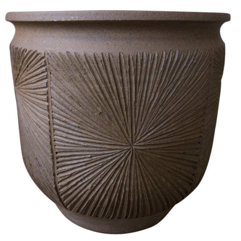California pottery artists David Cressey and Robert Maxwell formed Earthgender in the 1970s producing a small amount of these amazing vessels ranging in size and design but most with this natural brown color and many with the etched sunburst design.