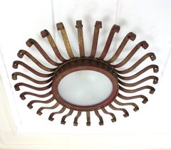 Plafoniera Sunburst Eyelash in ferro battuto, patina rossa dorata, anni '50