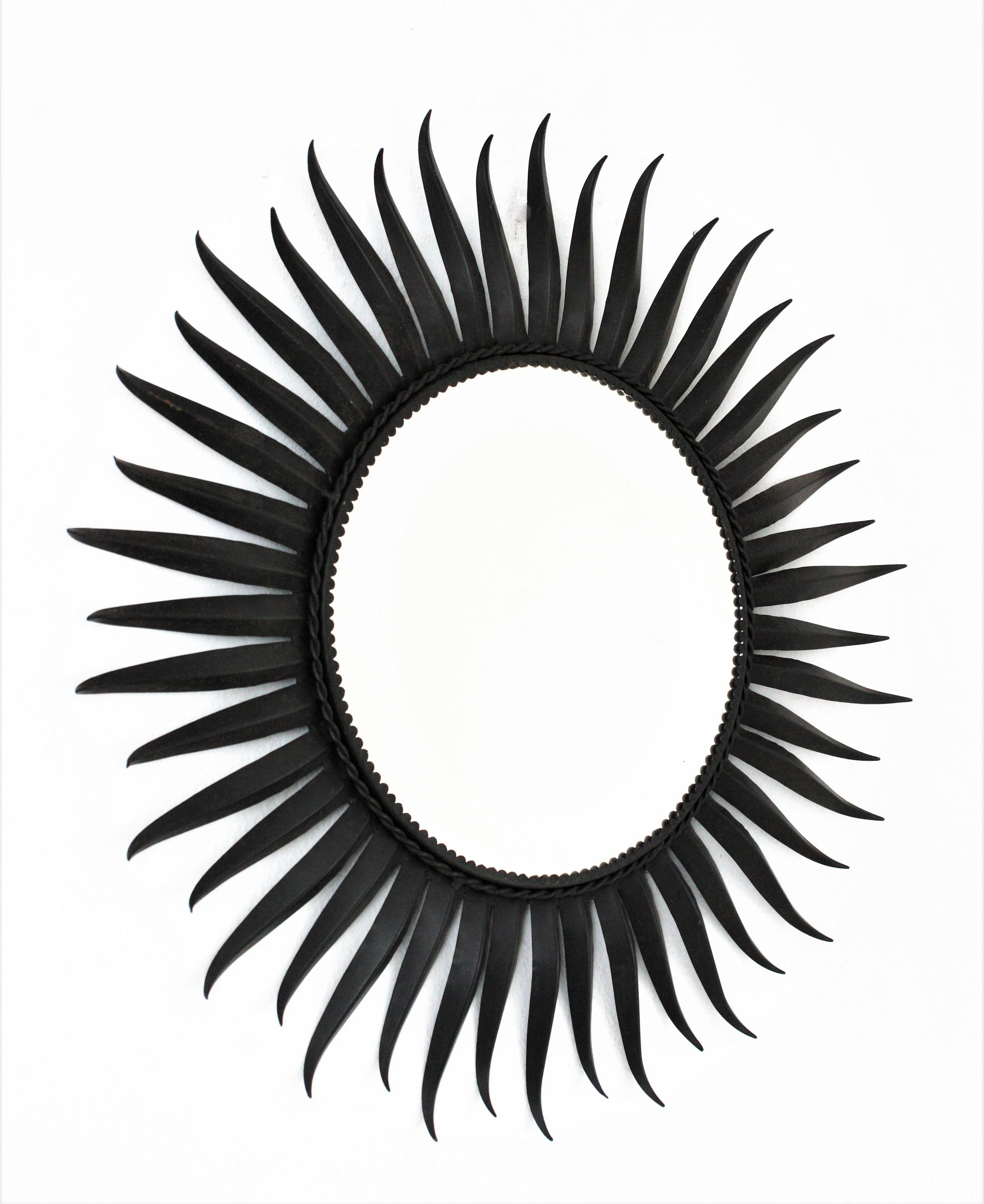 Mid-Century Modern Sunburst Eyelash Mirror in Black Wrought Iron For Sale