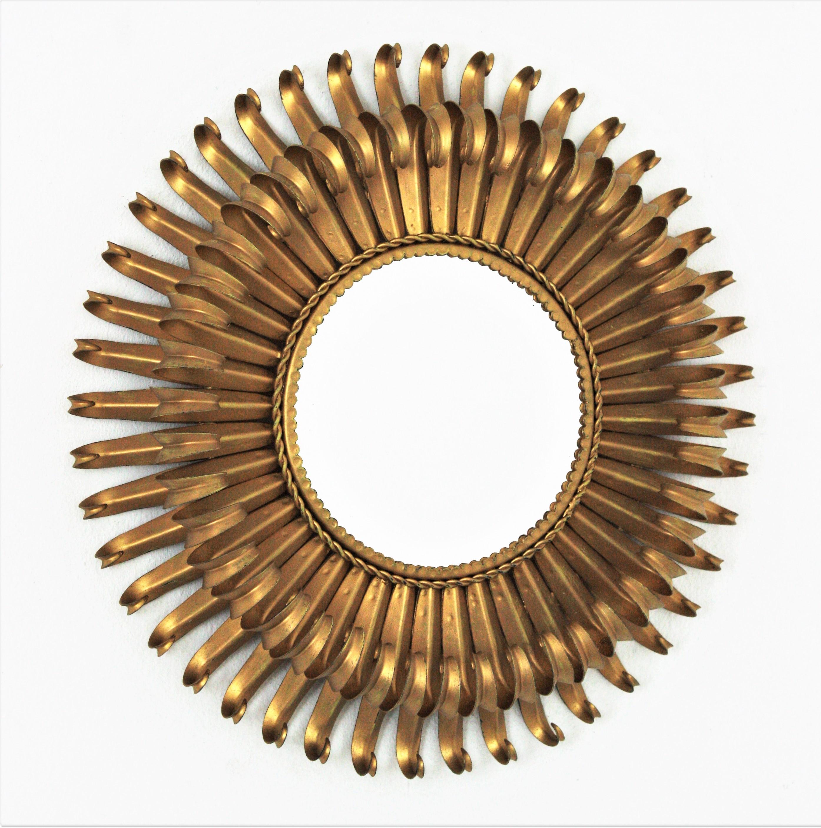 Eye-catching double layered eyelash gilt iron sunburst mirror, France, 1950s
The frame is made by a double layer of curved beams in eyelash shape.
It will be a nice midcentury addition wherever you place it. Beautiful alone but gorgeous as a part