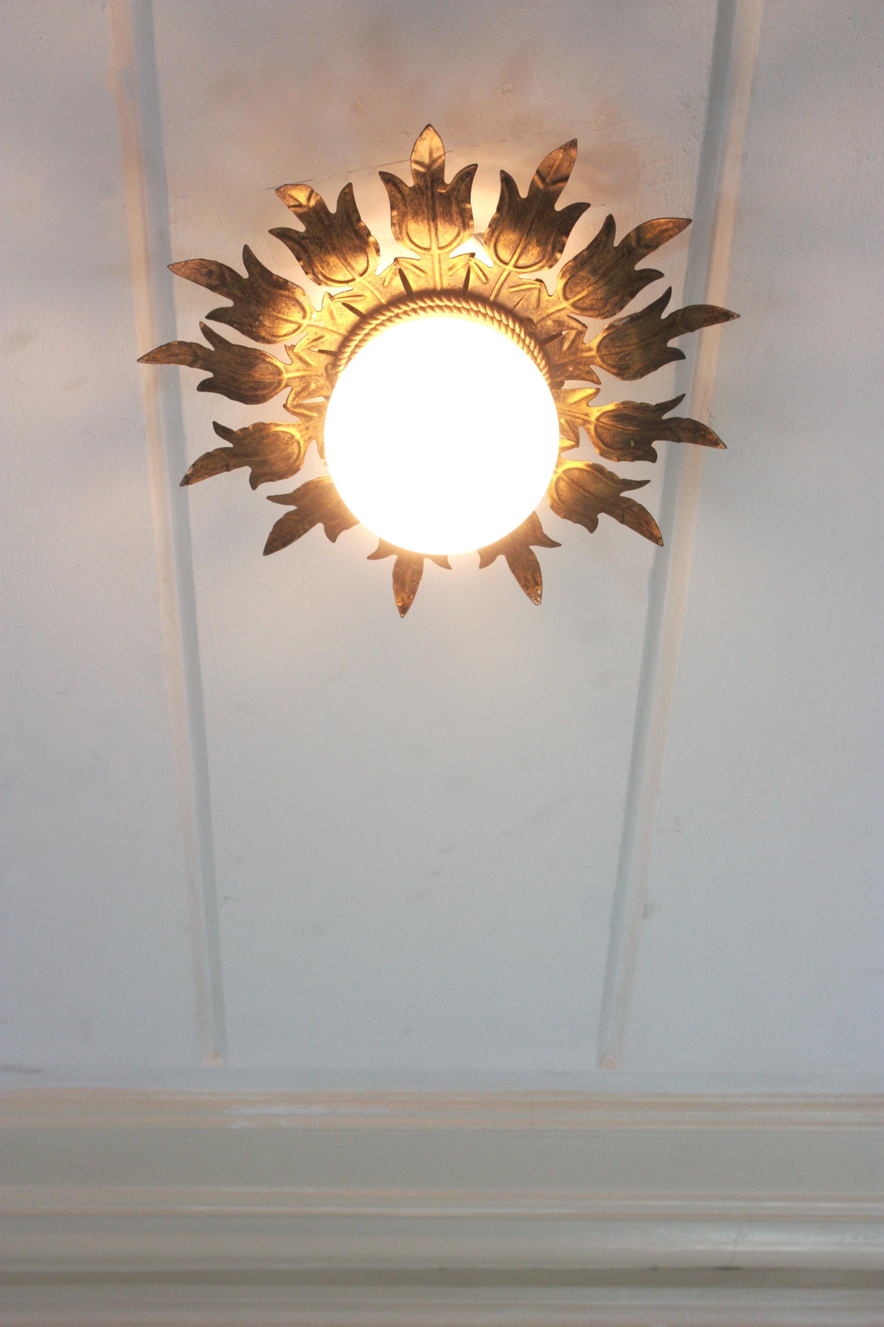 Spanish Sunburst Flower Ceiling Light Fixture in Gilt Iron and Milk Glass, 1950s For Sale