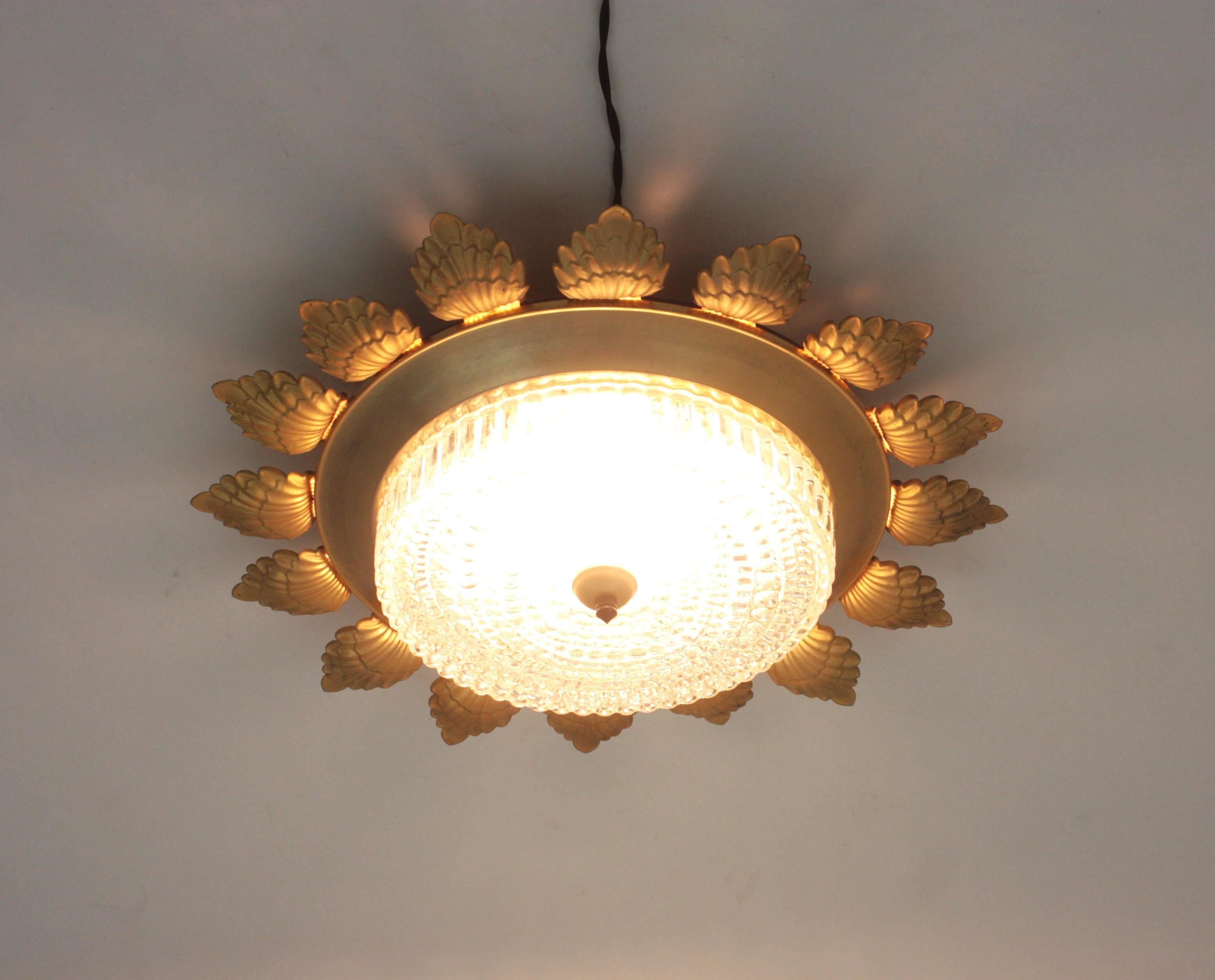 Spanish Sunburst Flower Flush Mount Light Fixture in Gilt Metal and Pressed Glass For Sale