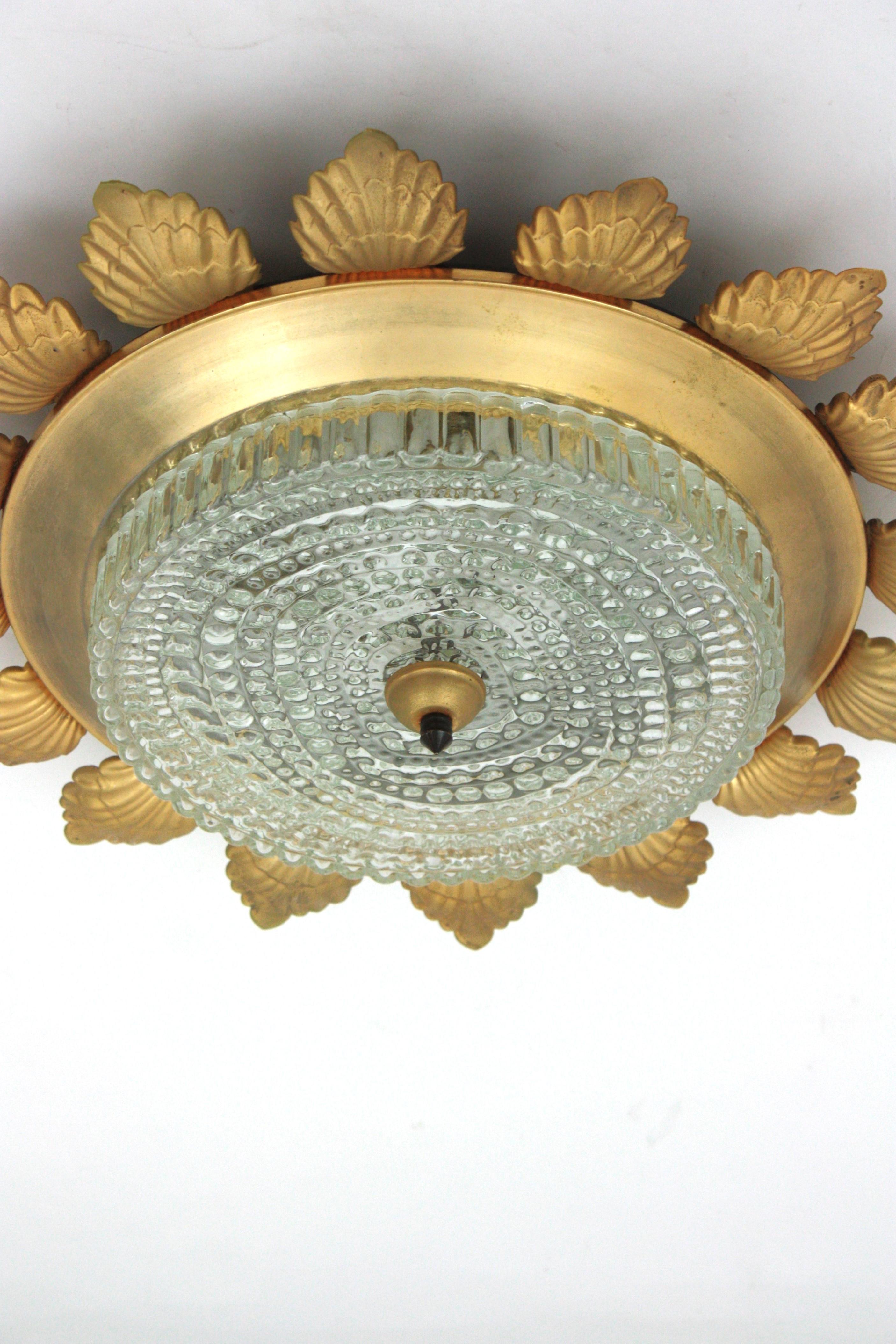 Sunburst Flower Flush Mount Light Fixture in Gilt Metal and Pressed Glass In Good Condition For Sale In Barcelona, ES