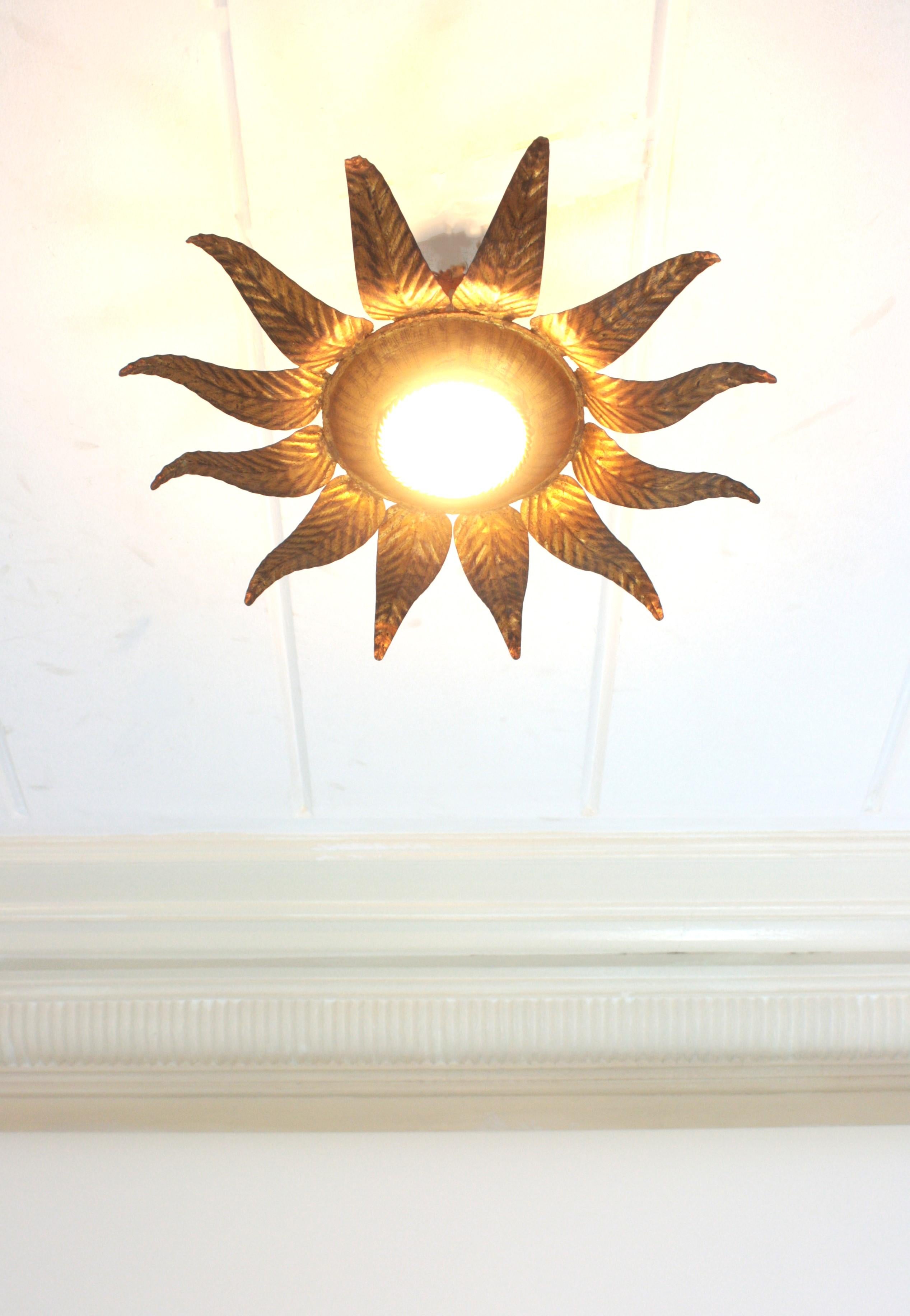 Hand-Crafted Sunburst Flower Light Fixture in Gilt Iron and Gold Leaf