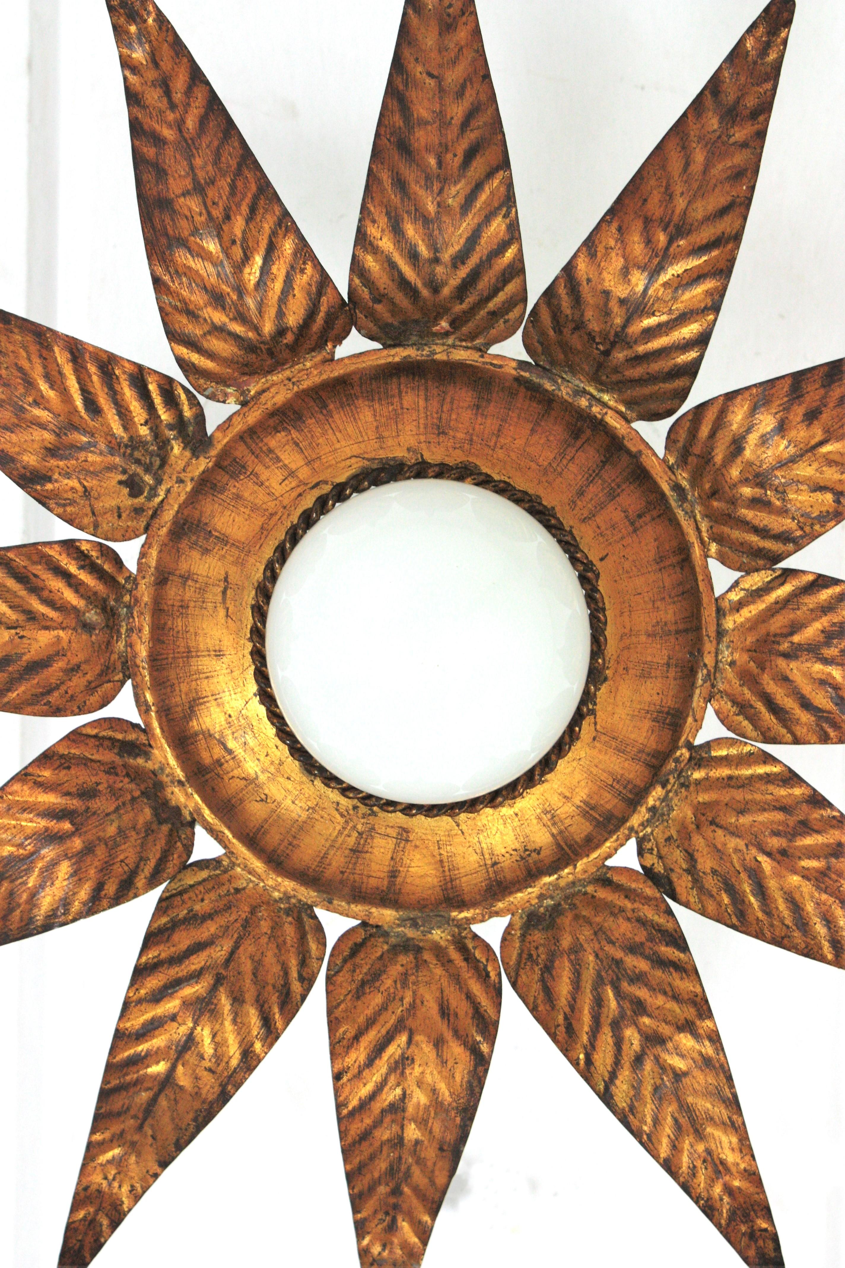 20th Century Sunburst Flower Light Fixture in Gilt Iron and Gold Leaf For Sale