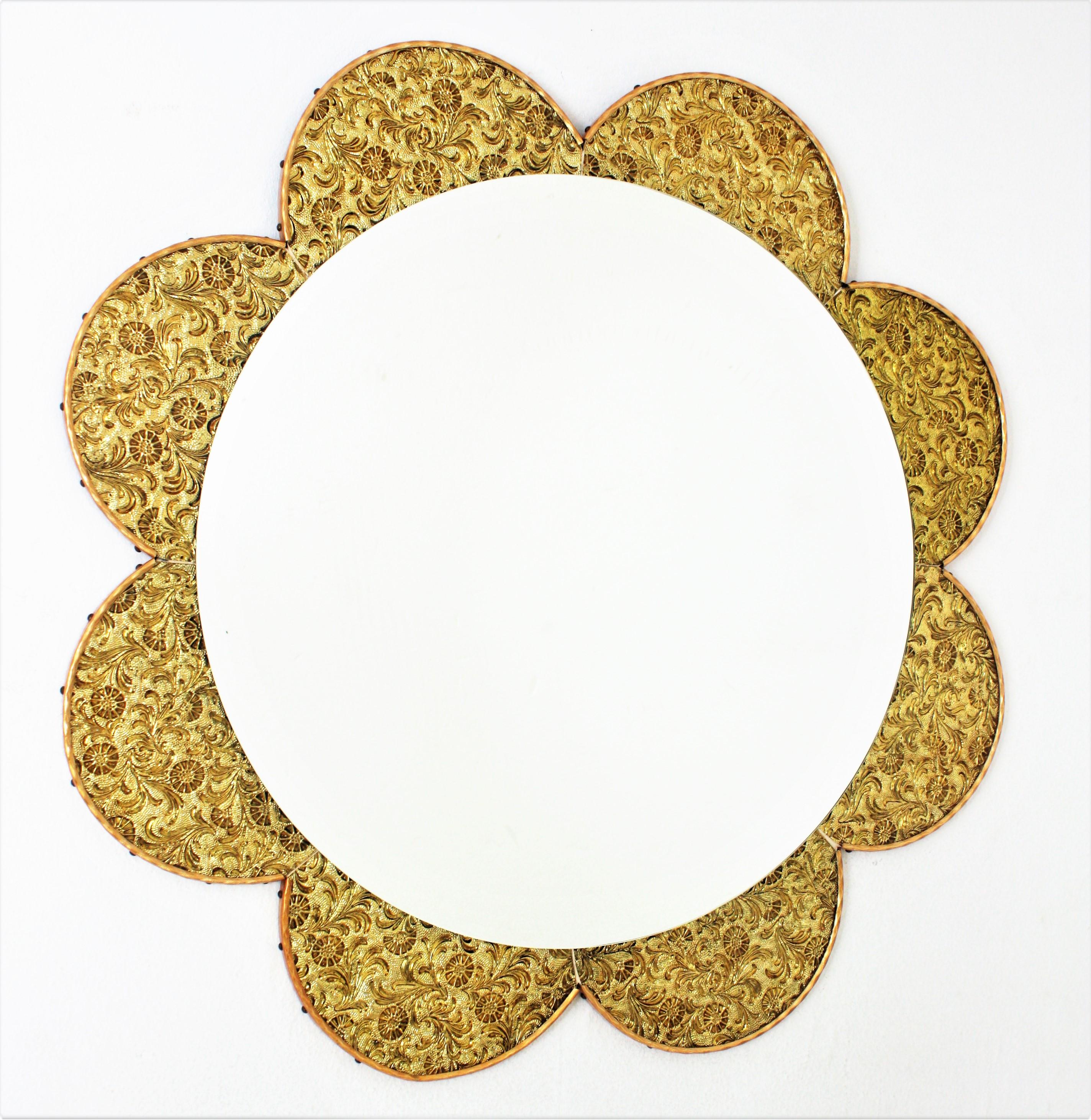 Sunburst mirror with the shape of a Daisy flower, Golden glass Frame, 1960s-1970s.
Eye-catching flower burst mirror with petals frame made with pieces of iridescent golden glasses. The mirrored golden petals have a heavily adorned design with