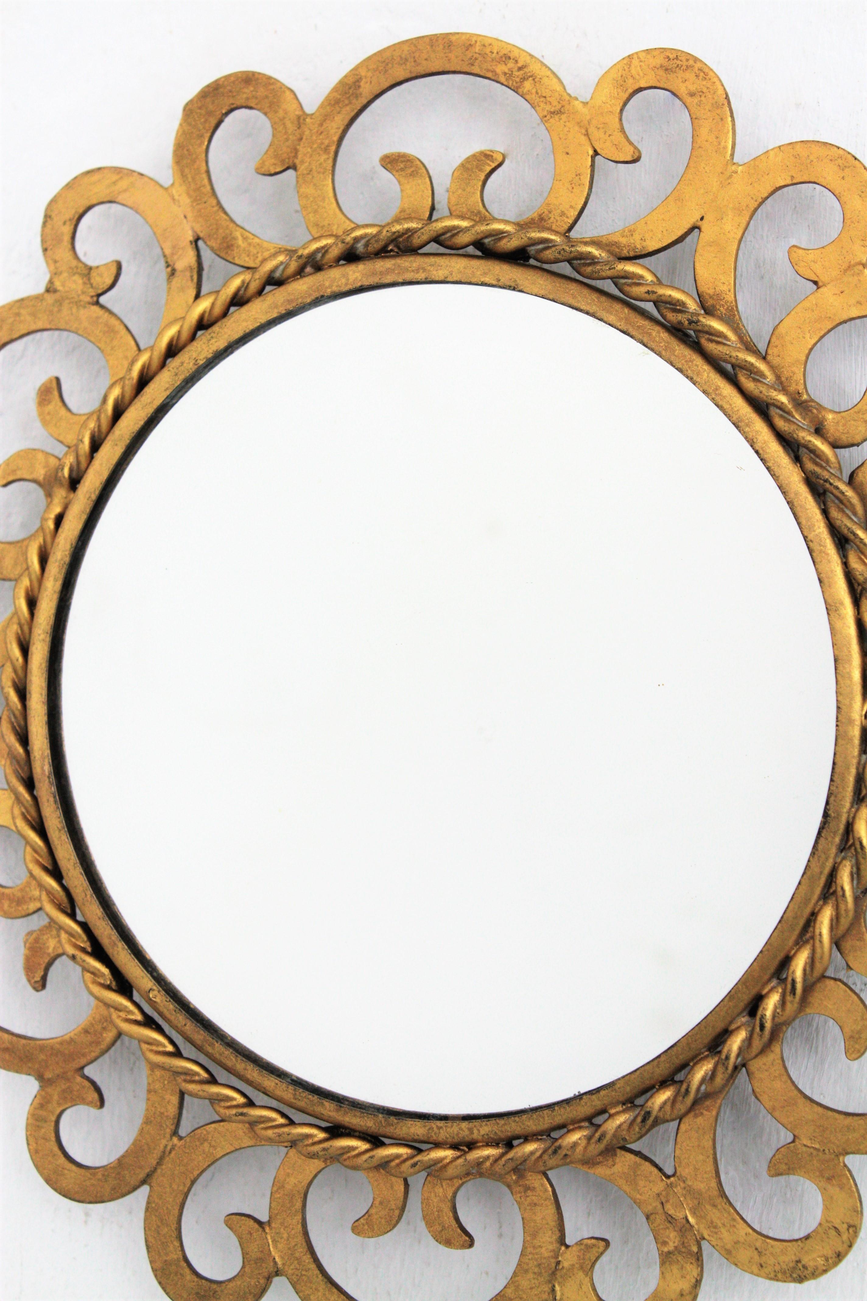 Mid-Century Modern Mini Sized Sunburst Mirror with Scrollwork, Gilt Iron For Sale