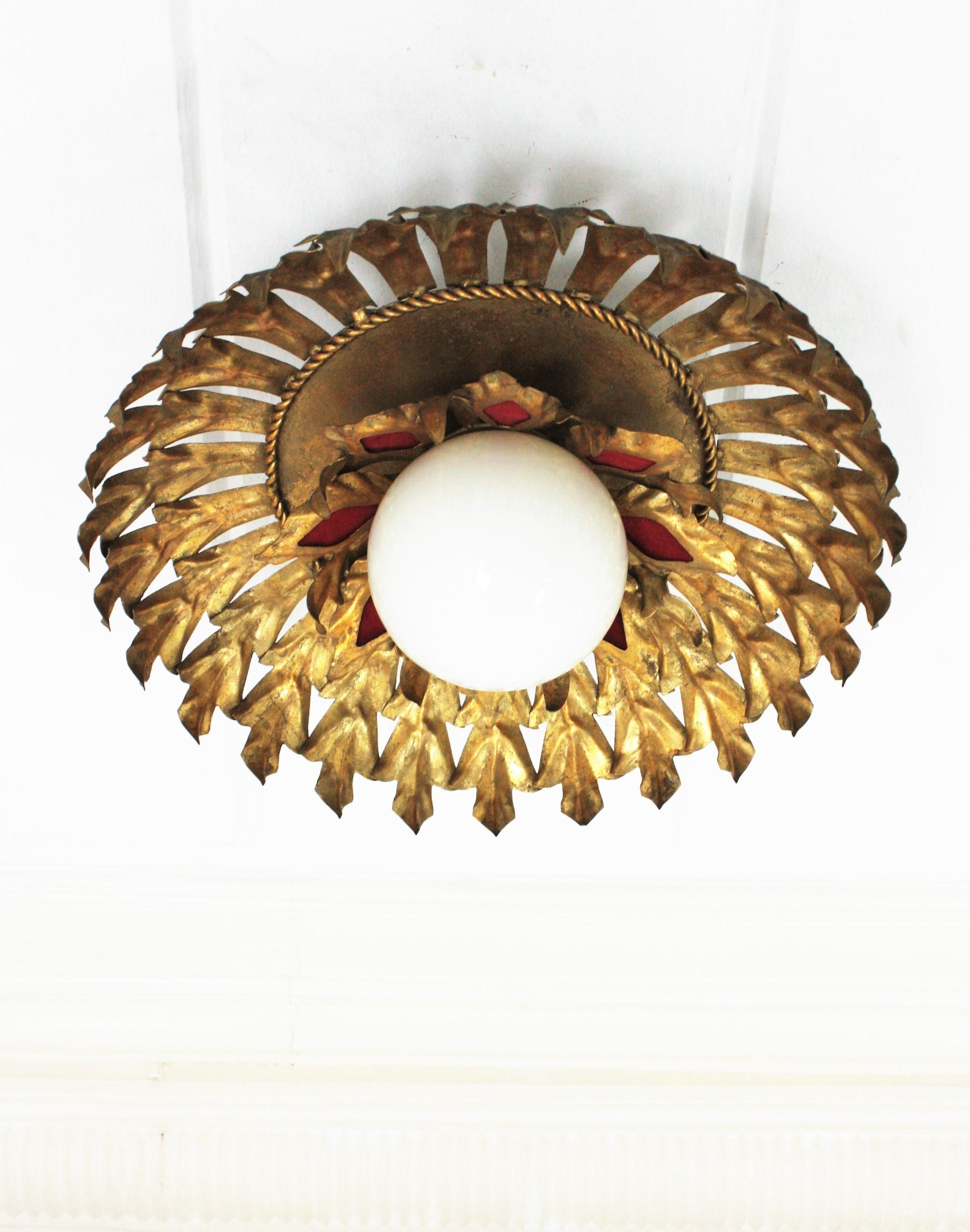 Sunburst Flush Mount Light Fixture in Gilt Iron and Milk Glass Globe In Good Condition For Sale In Barcelona, ES