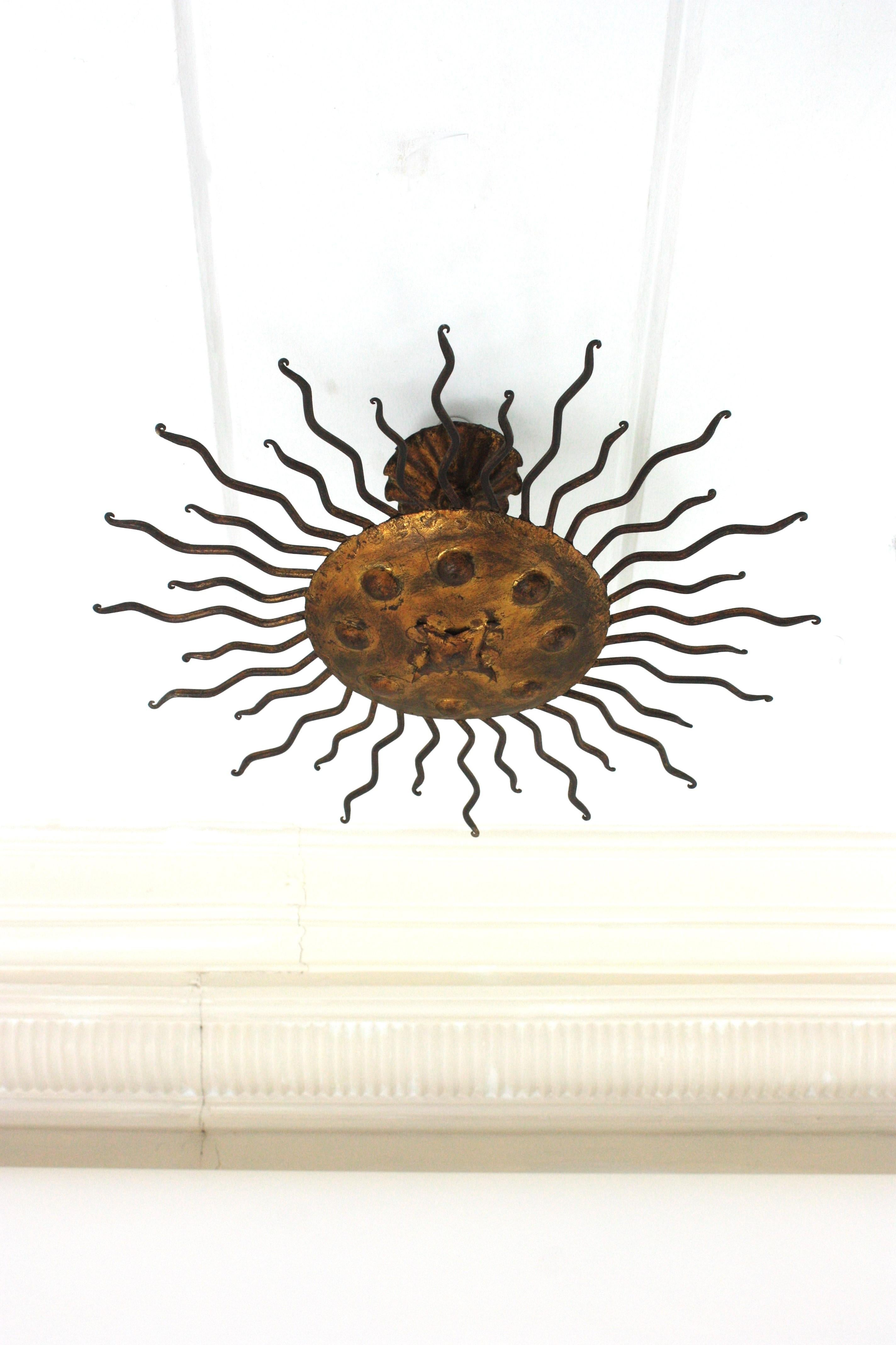 Spanish Sunburst Flush Mount Light Fixture with Curly Rays, Gilt Iron For Sale