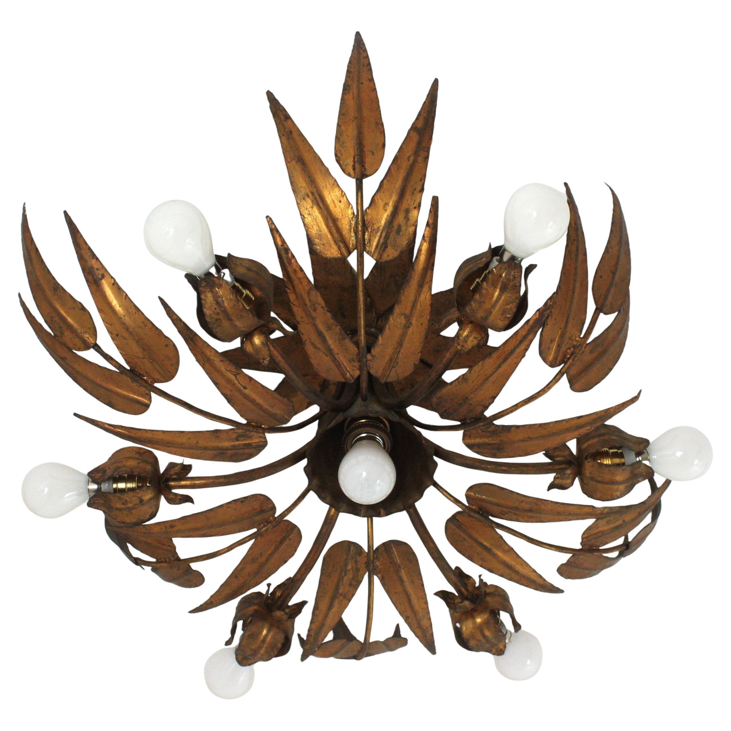 Outstanding spanish foliage floral sunburst flush mount ceiling light in gilt iron, Ferro Art, 1950s
To be used as ceiling light fixture or as chandelier / pendant light adding a chain to the desired height.
This seven-light ceiling lamp features an