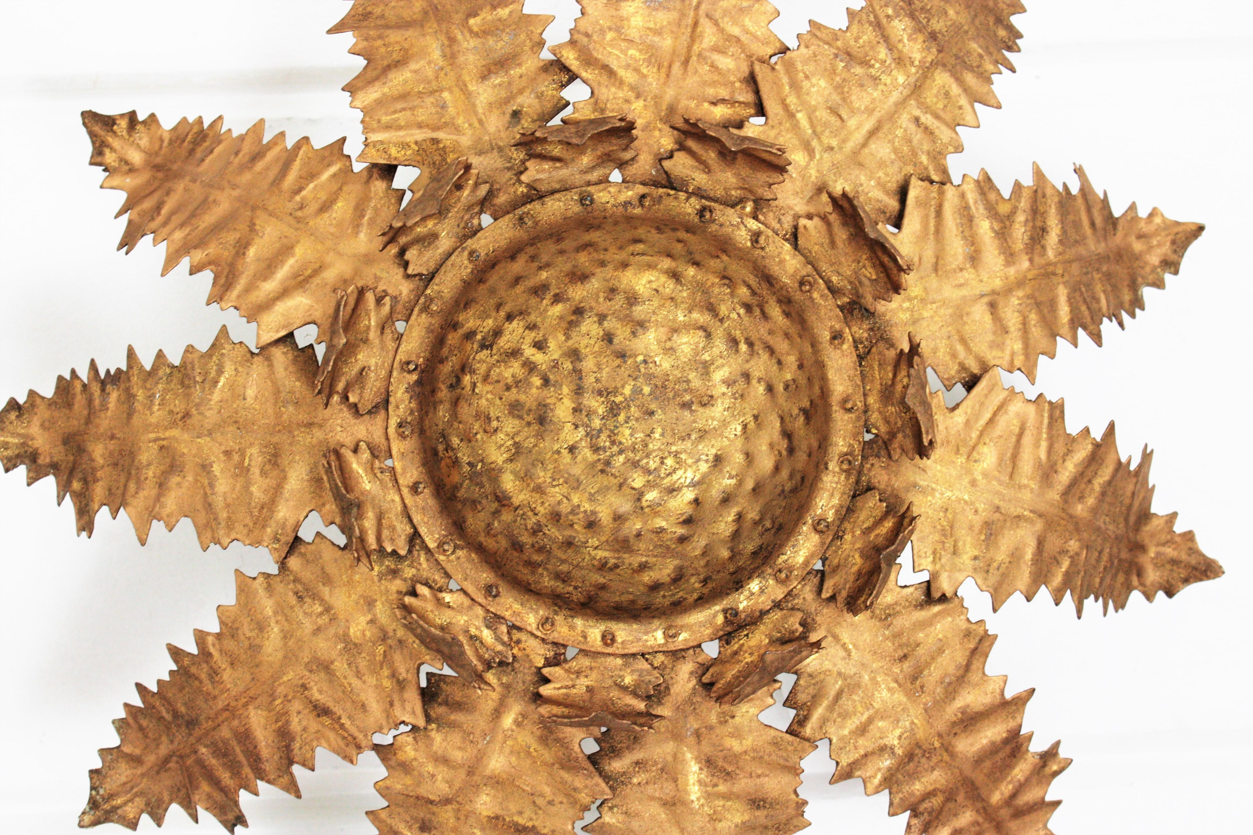 Hammered French Sunburst Leafed Light Fixture in Gilt Iron, 1950s For Sale