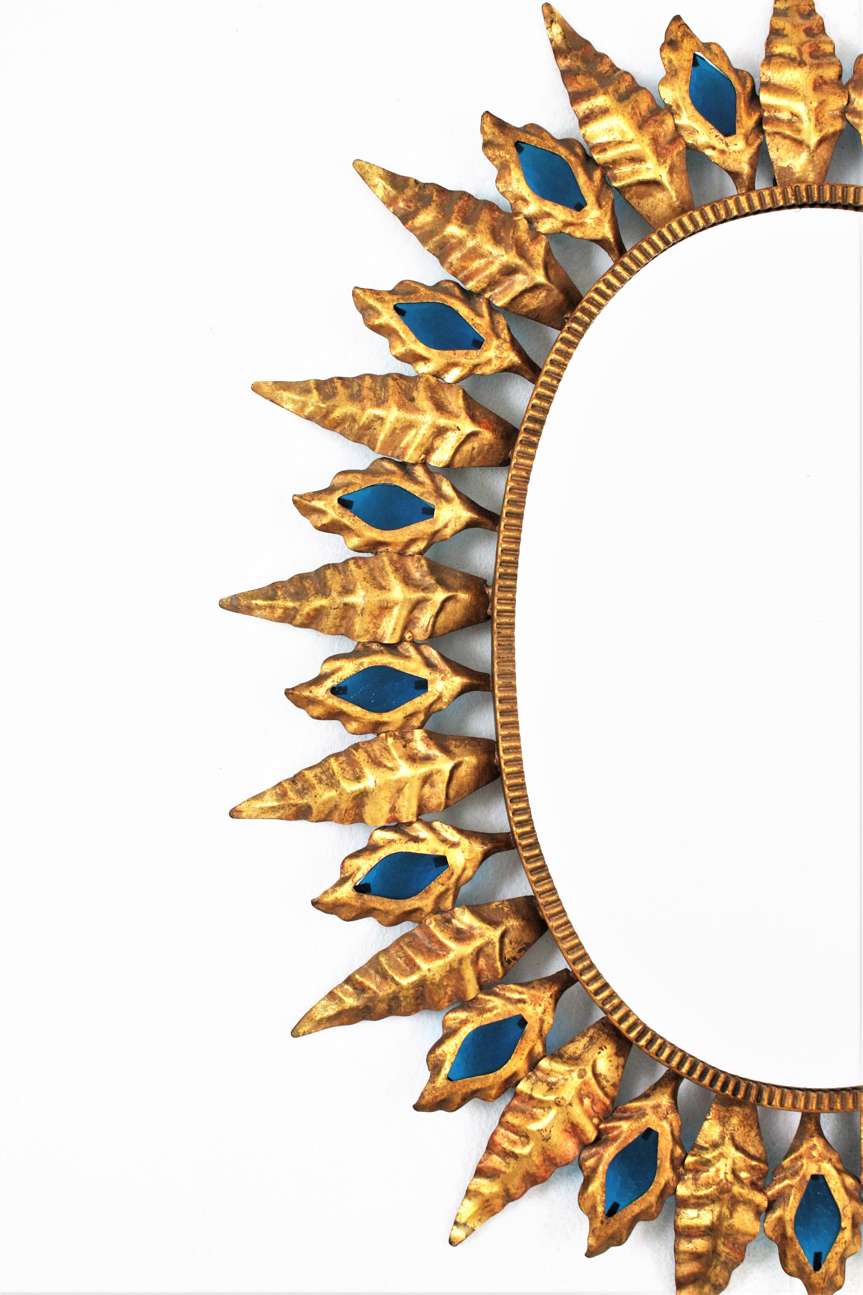 Gold Leaf Sunburst Mirror with Blue Glasses, Gilt Iron, Hollywood Regency Style