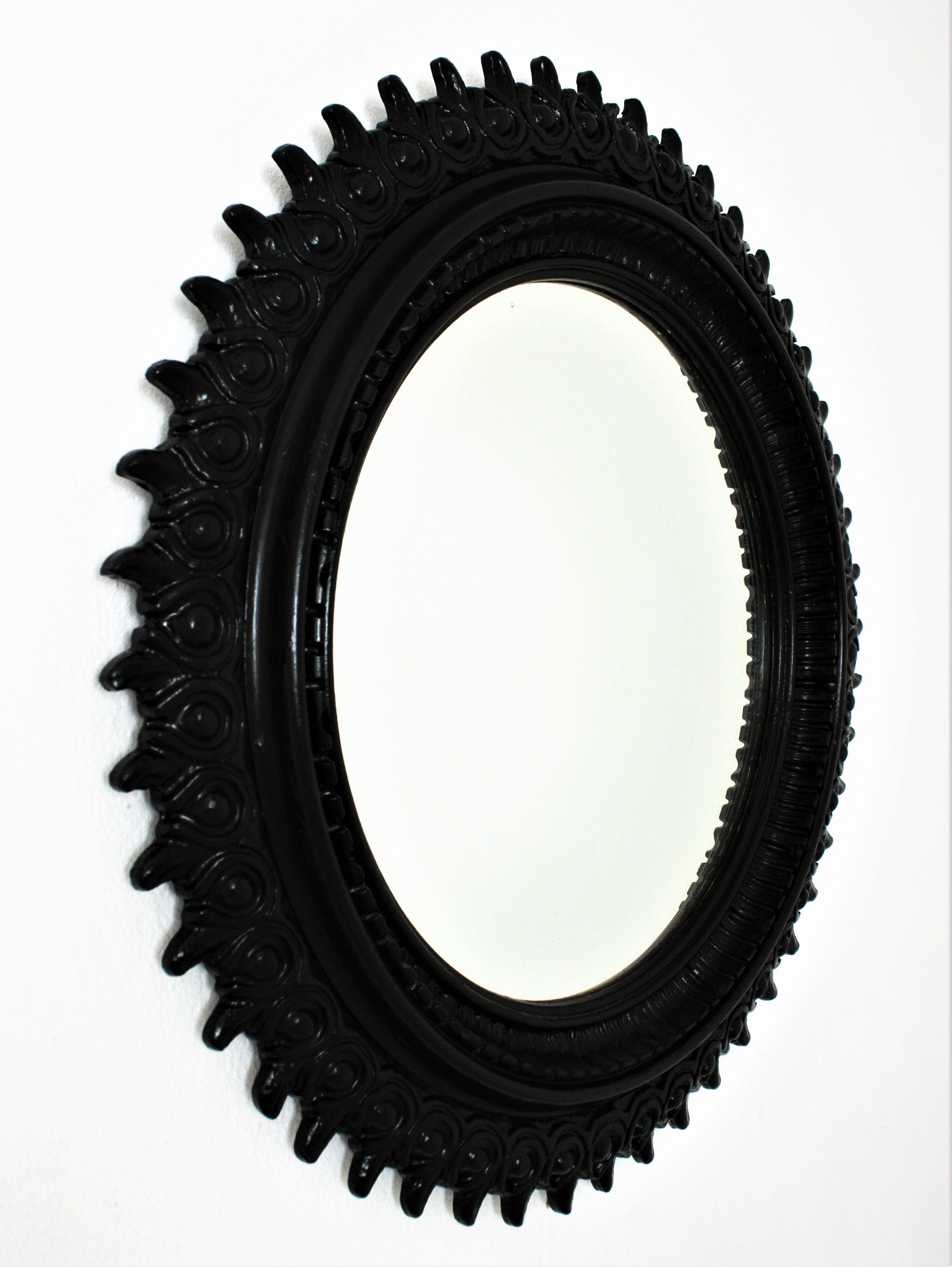 Spanish Sunburst Mirror in Carved Wood and Black Patina by Francisco Hurtado For Sale