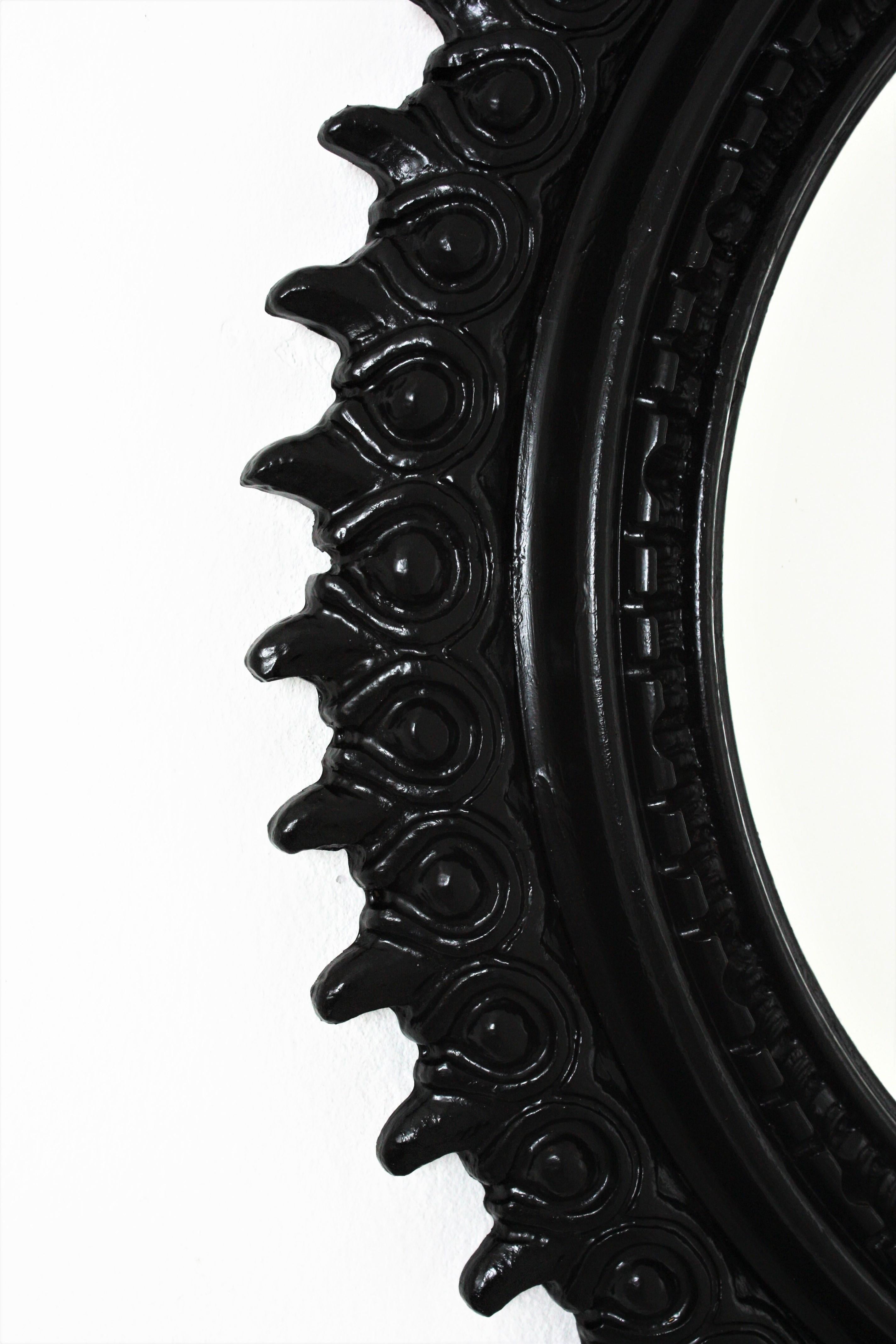 20th Century Sunburst Mirror in Carved Wood and Black Patina by Francisco Hurtado For Sale