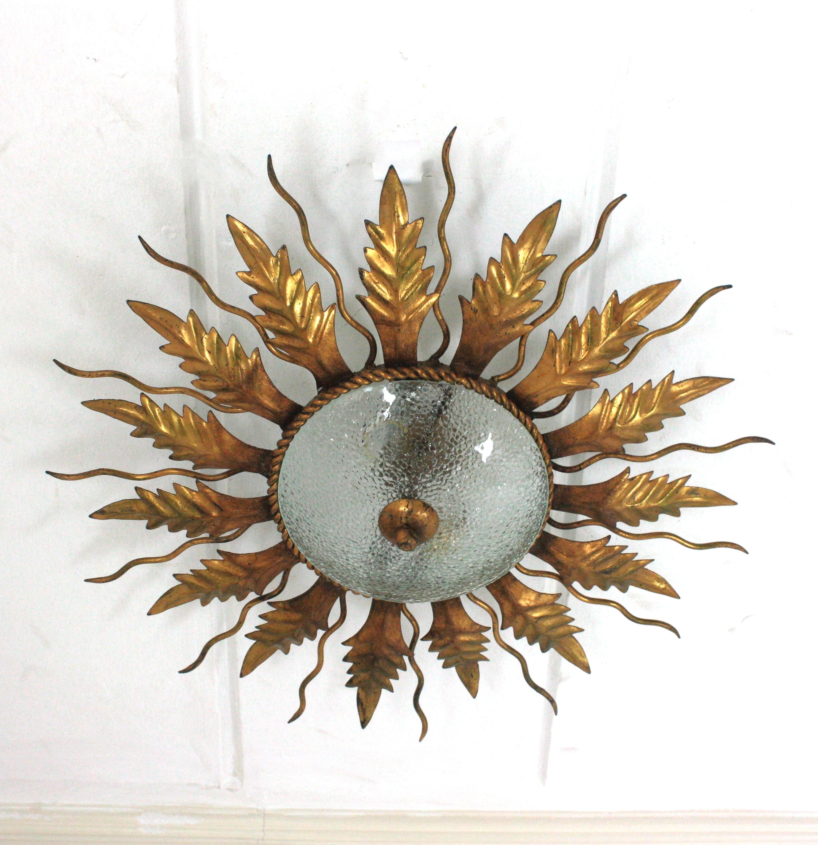 Forged Sunburst Light Fixture / Flush Mount in Gilt Wrought Iron and Cracked Glass For Sale