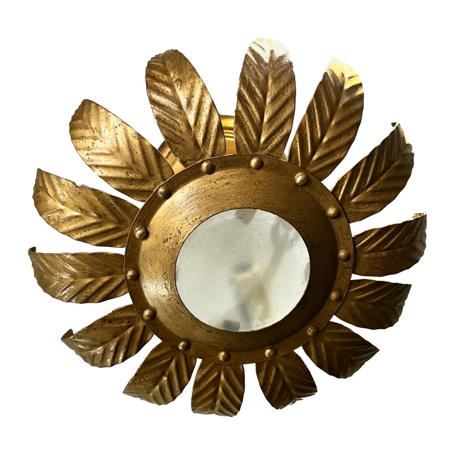 A circa 1930's French sunburst fixture with glass inset.

Measurements:
Height (drop:) 7